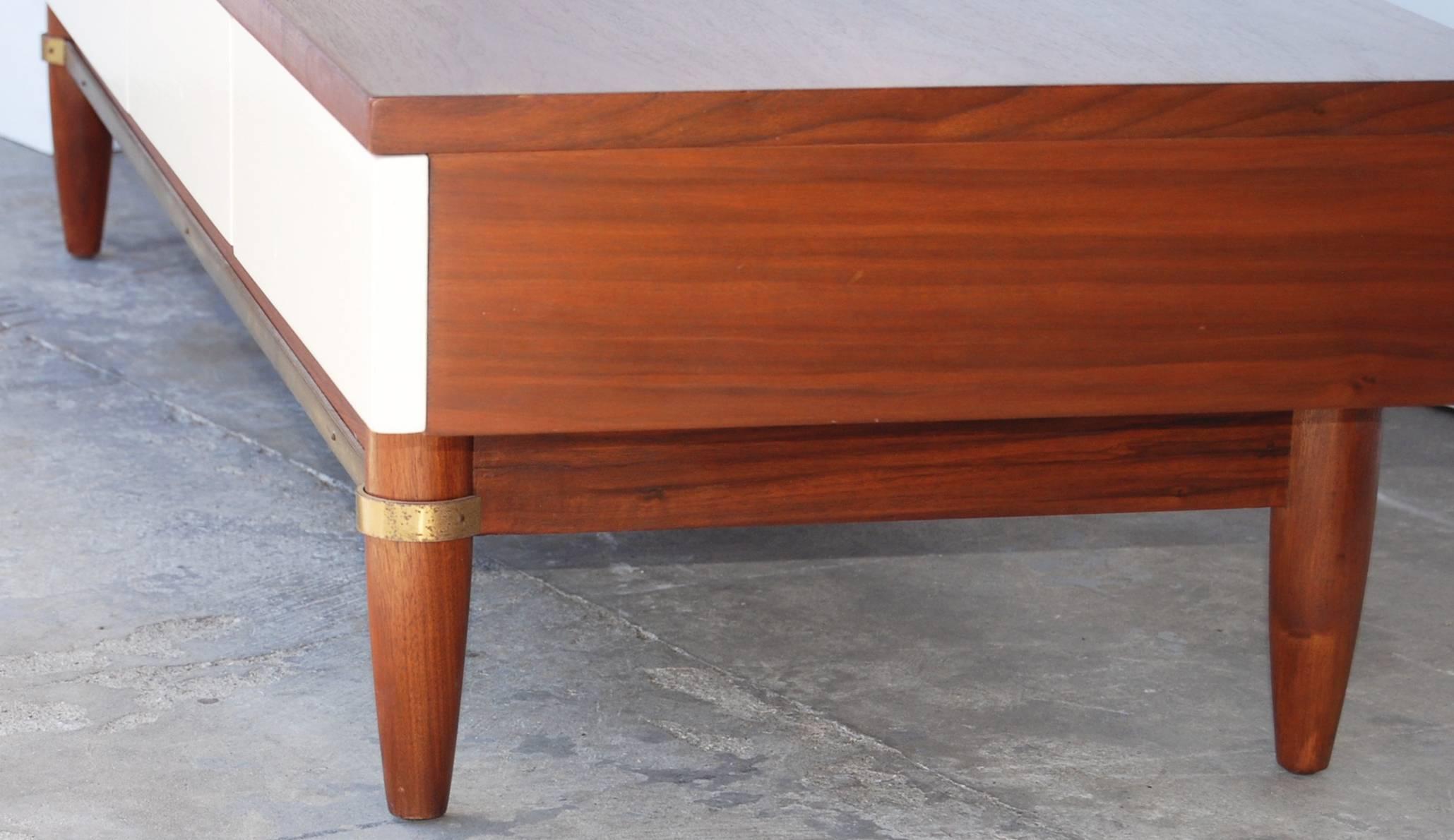 Merton Gershun  bench, part of the Dania collection for American of Martinsville. Drawers across the front are off-white lacquer. Brass stretchers.