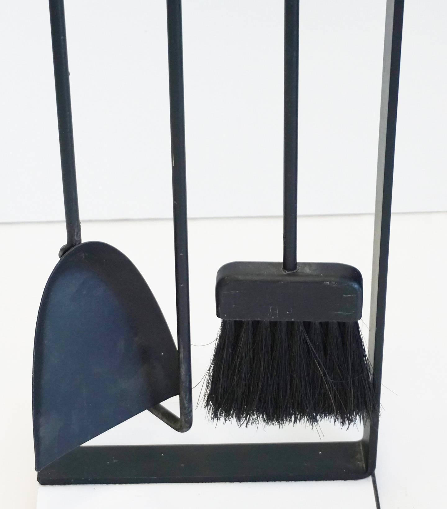A neat and elegant fire tool set in enameled steel, aluminum and fiber. Comprising a poker, shovel, and brush suspended from a weighted cantilevered stand. Attributed to Pilgrim manufacturing, circa 1960s.
   
  
  