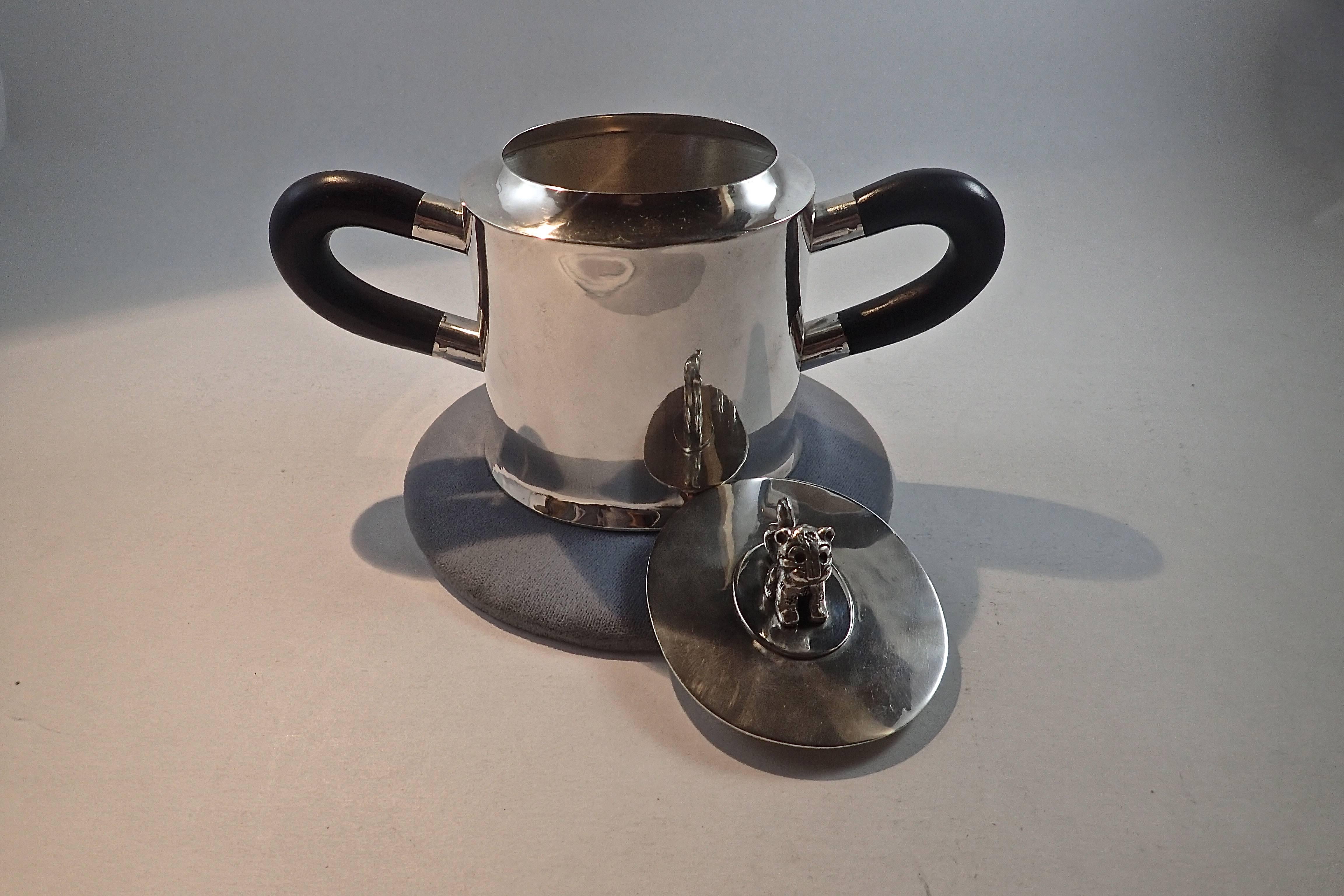 Five piece sterling silver tea set with finished ebony handles created by Spratling in Taxco, Mexico. Tray is not the original.

Covered Creamer: 3.5 x 5.75 inches
Sugar Bowl: 3.5 x 6.5 inches
Coffee Pot: 6 x 8 inches
Large Coffee Pot: 8 x 10.5