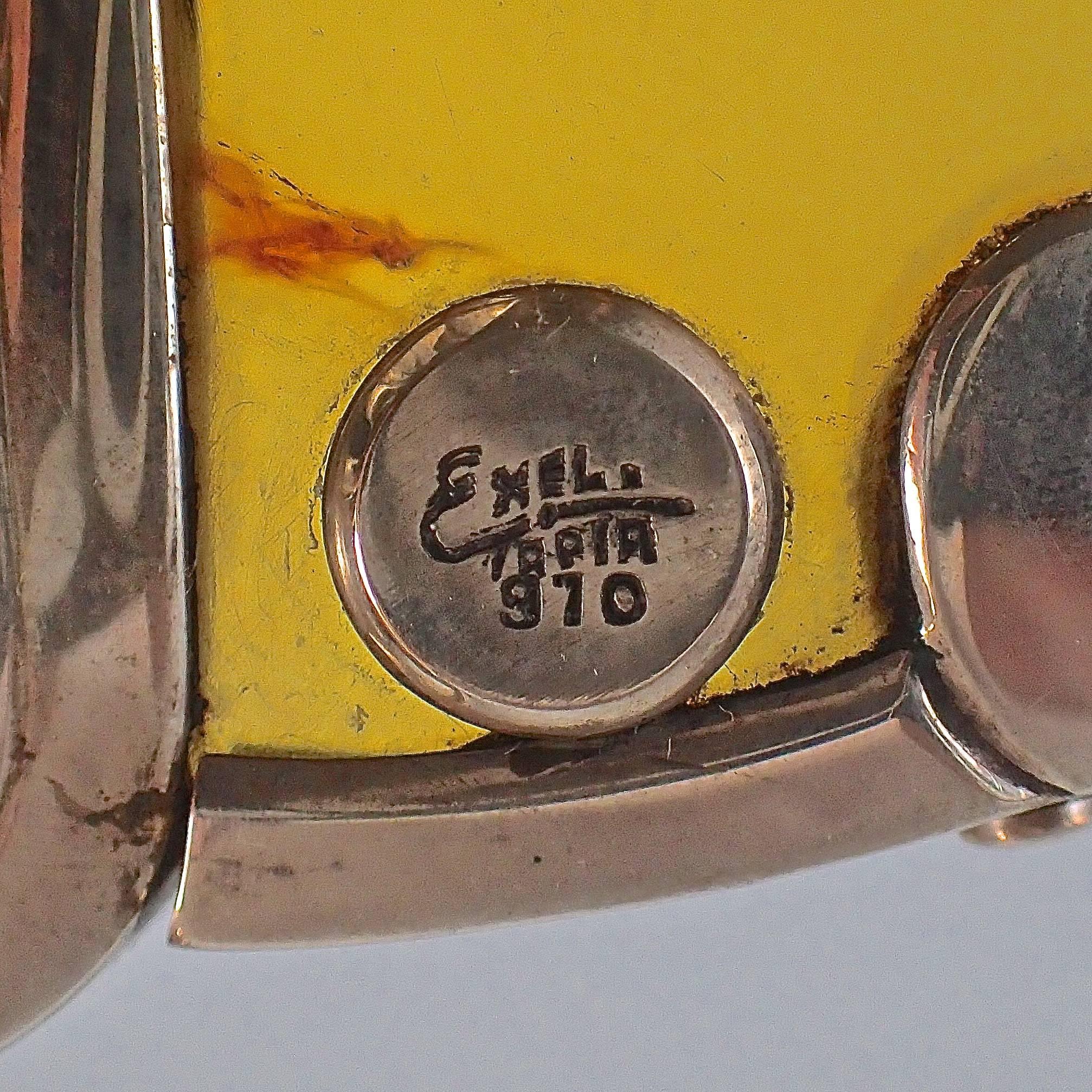 One single piece of amber creates this stunning handle mounted onto 970/1000 sterling silver pitcher manufactured by Ezequiel Tapia in Taxco, Mexico. Soldered sterling silver mexican motifs with soldered amber cabochons decorate the pitcher. 
