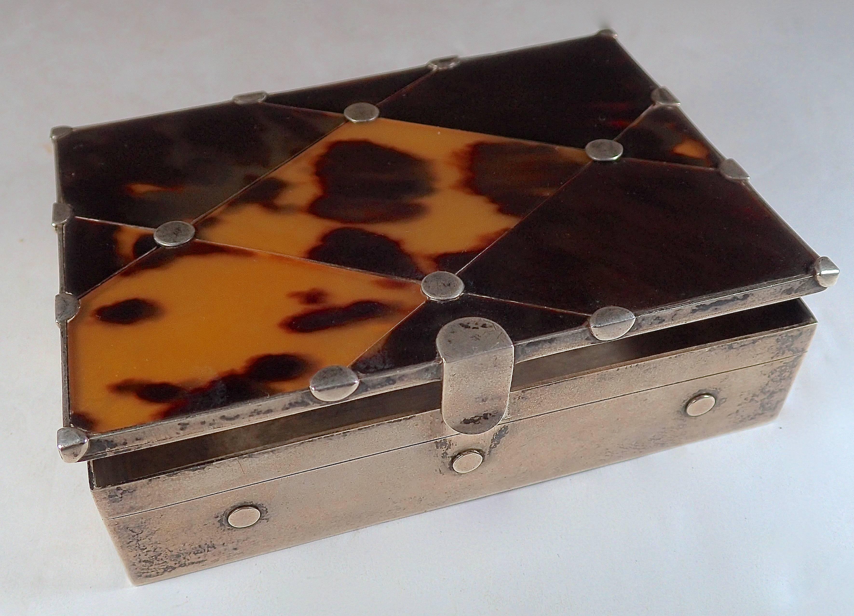 Sterling silver dots set the diamond cut tortoise shell that create the lid. Both boxes feature a tension clasp in the front and hinged opening (pictured). Silver mark Eagle with 30. 

Second box dimensions:
Width: 3.44 inches.
Height: 1.13