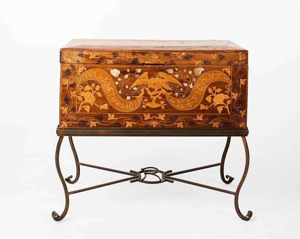 Mexican trunk, inlayed mother-of-pearl, with iron stand. 
Made in Puebla, Mexico, 1886. Over the years this hand-crafted trunk has maintained its beauty and structural integrity. The quality of the inlayed mother-of-pearl still remains; along with
