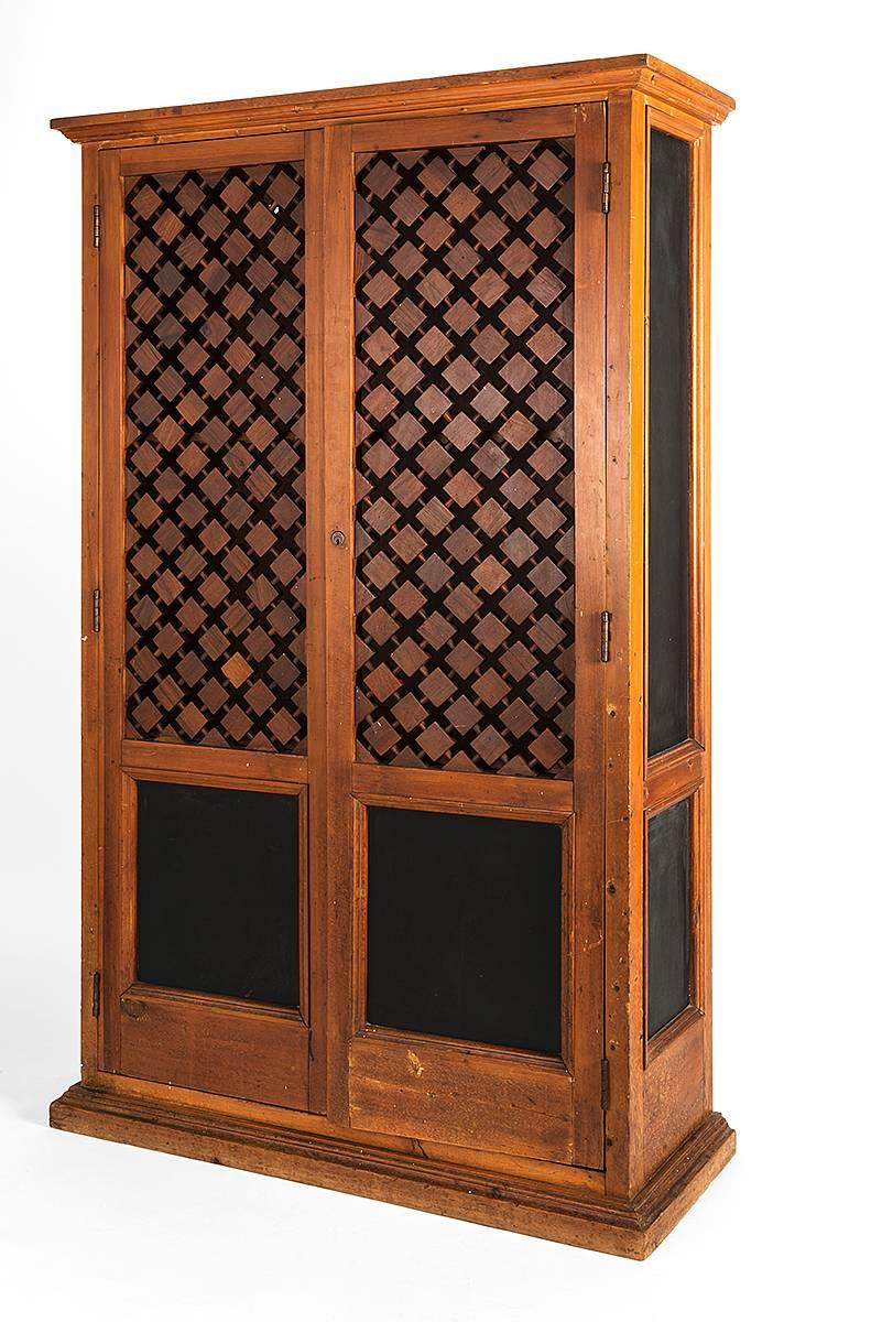 Repeating diamond pattern creates the eye-catching design the 'Rangelino' style is known for. In addition, this armoire has four (4) inset leather panels featured in the front and sides. 
Inside two removable shelfs can be placed in the range of 38