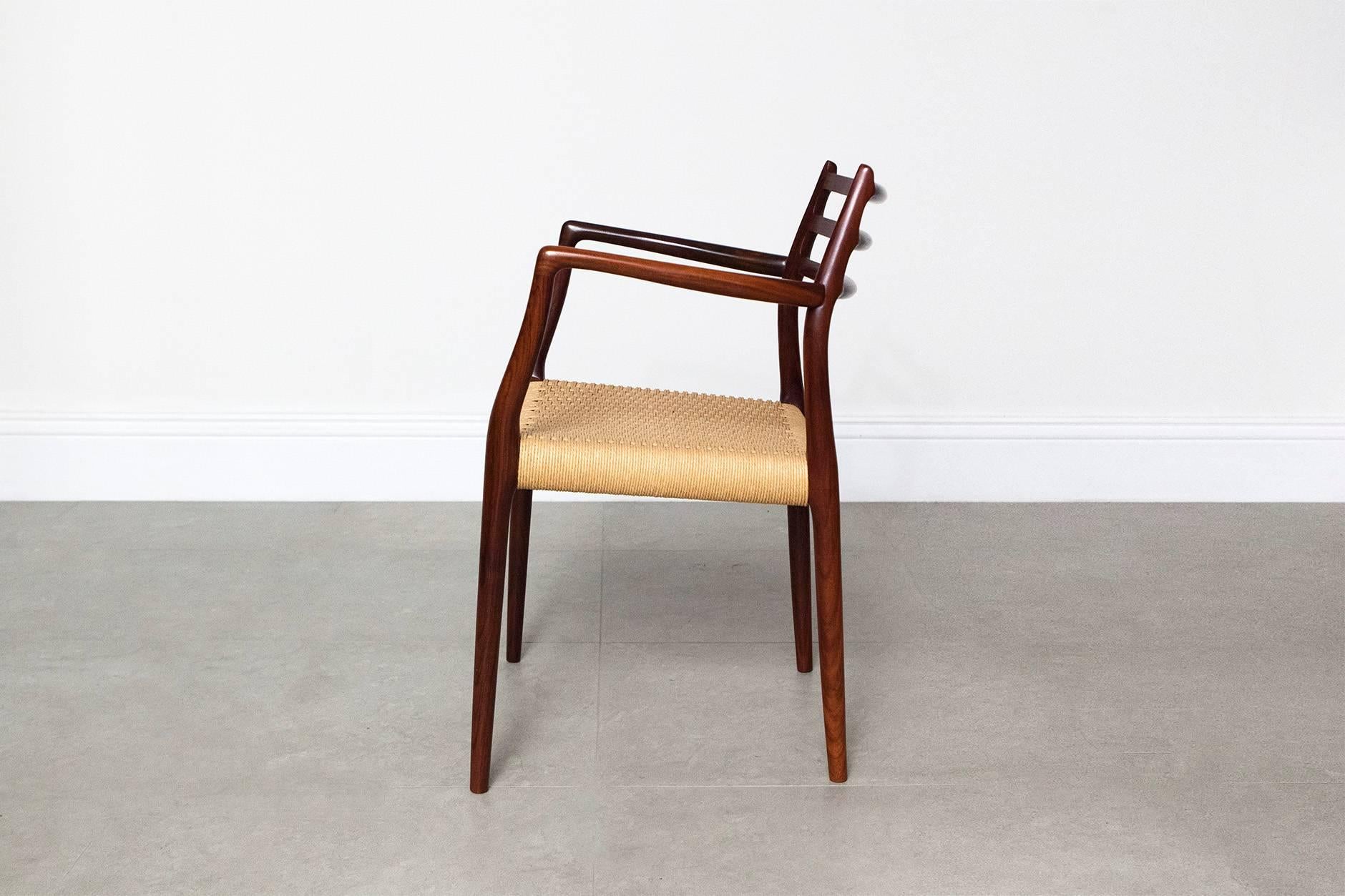 The award winning model 62 chair from Danish designer Niels Moller for J.L Moller Mobelfabrik, 1962. This rare example comes with original woven paper cord seat in near-mint condition. 
