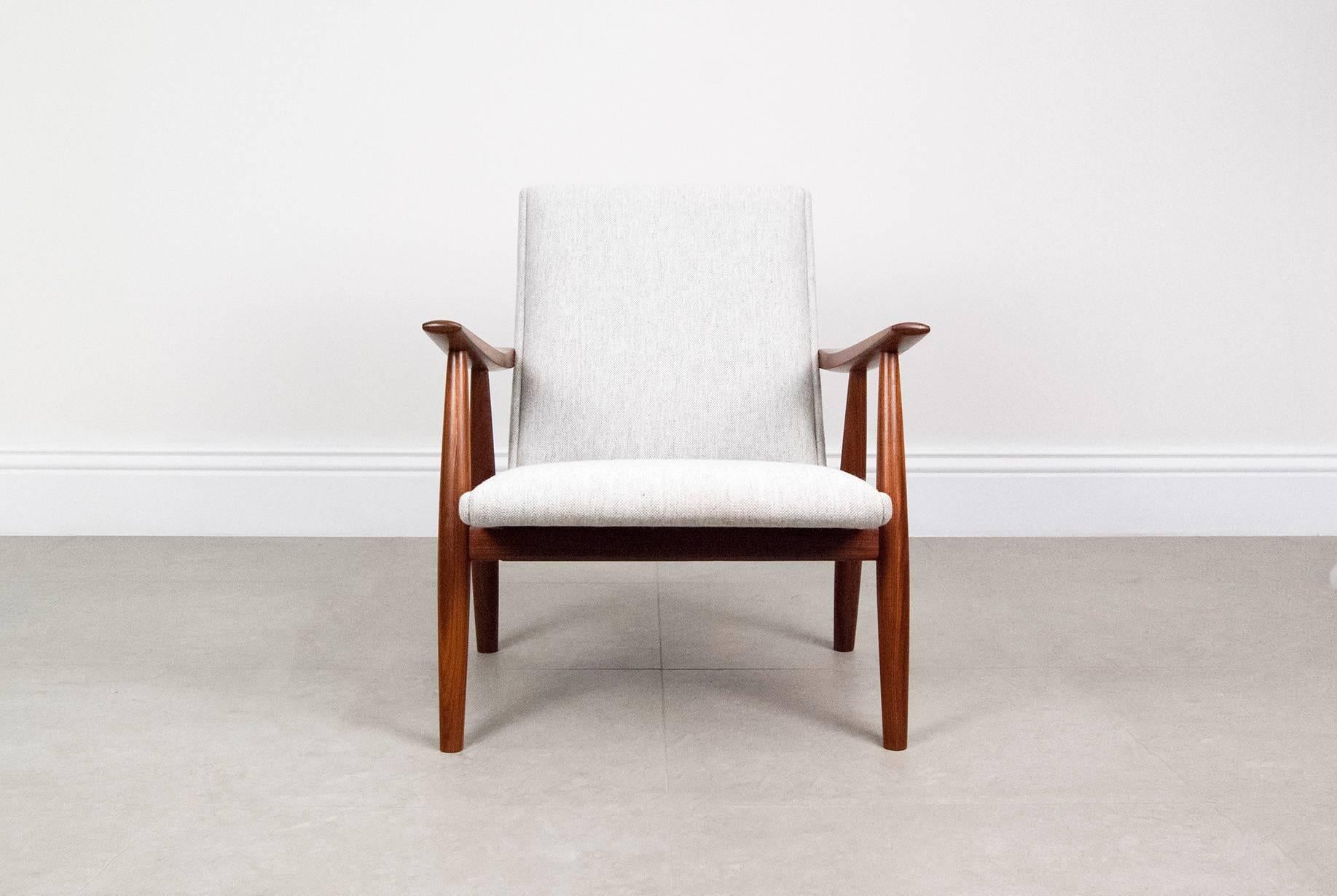Hans J. Wegner GE-260 chair, 1958. Produced by GETAMA, Denmark. Solid Afromosia teak frame, sprung seat reupholstered in Kvadrat Hallingdal fabric. Polished brass fittings.
