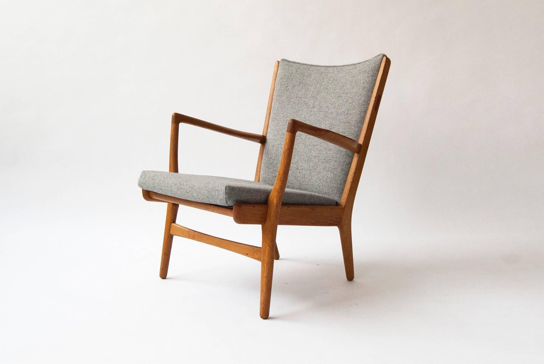 Hans J. Wegner AP-16 chair, 1952. Produced by A.P. Stolen, Denmark. Rare easy chair in oak with new Kvadrat Hallingdal wool fabric.