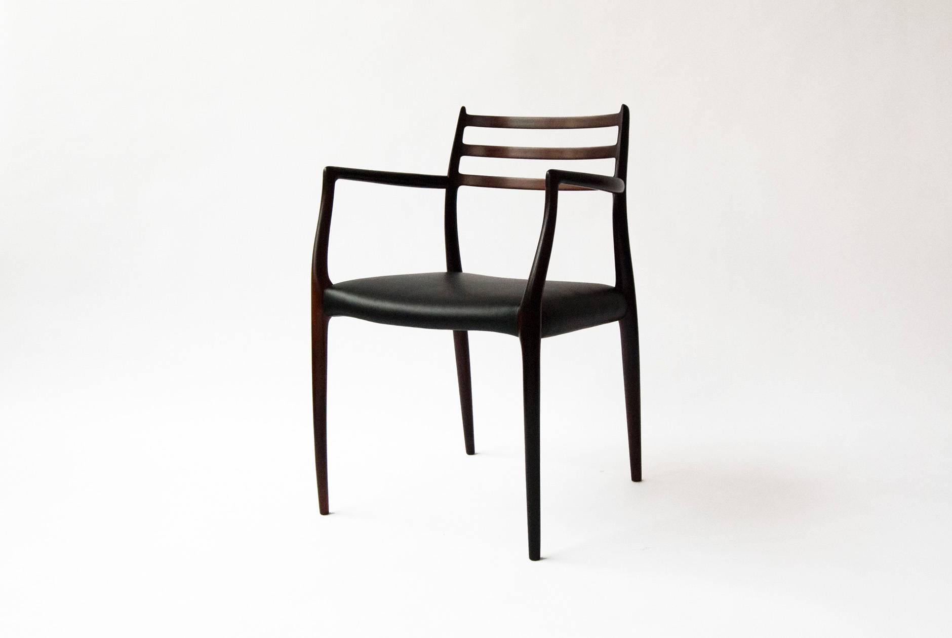 Niels O. Moller model 62 armchair. Solid Brazilian rosewood armchair. Produced by J.L Moller Mobelfabrik, 1962. Seat upholstered in new black leather.