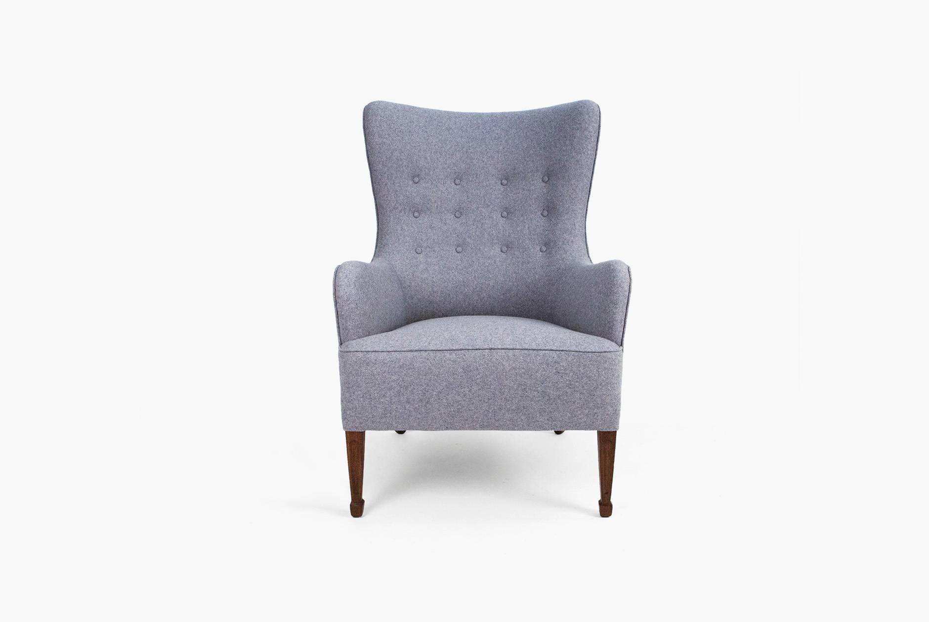 Wing chair from master cabinet maker Frits Henningsen for Georg Kofoed, Copenhagen with profiled mahogany legs. Reupholstered in Kvadrat Divina fabric.