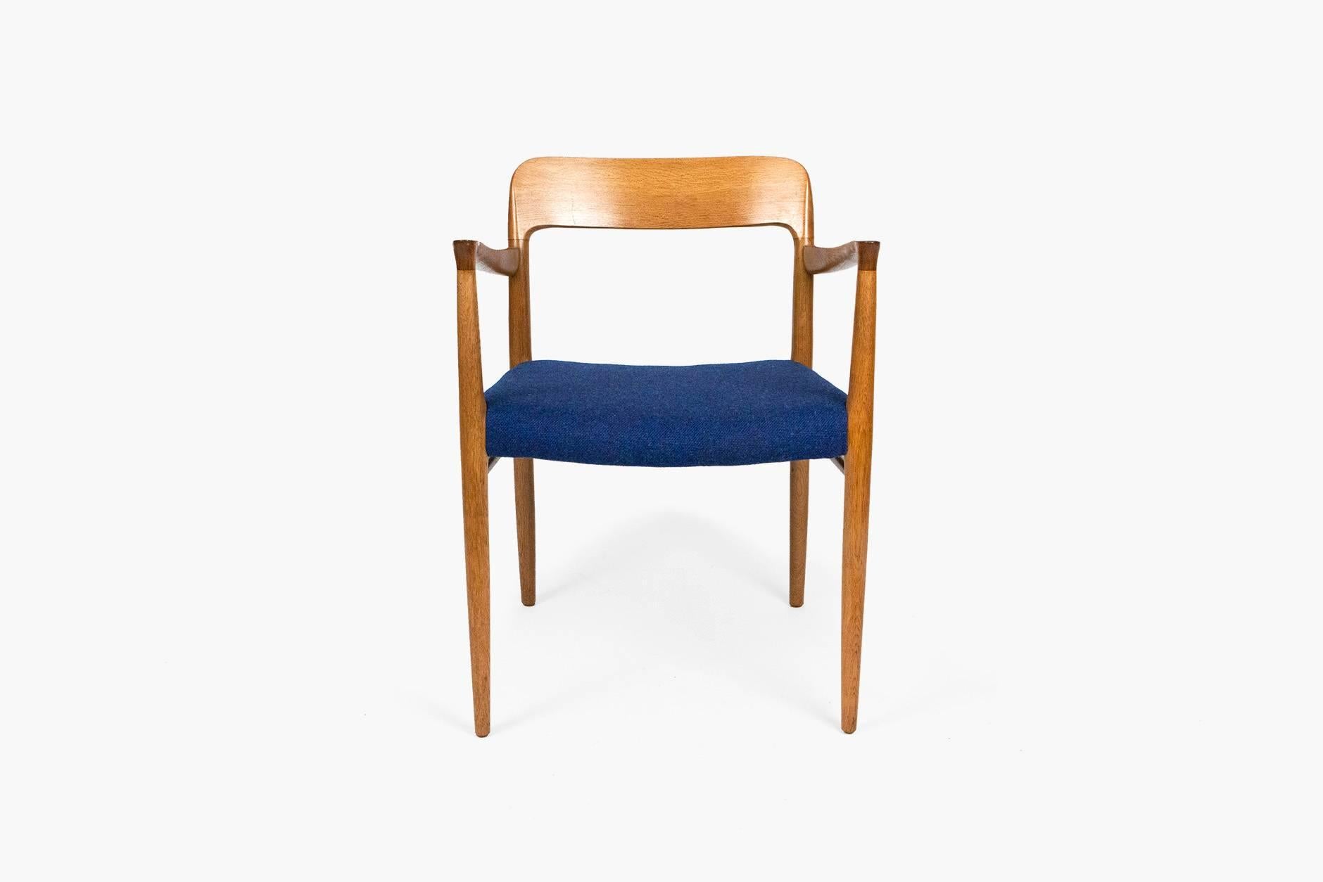 Model #56 armchair in solid oak designed by Niels Moller in 1954 for JL Moller Mobelfabrik, Denmark, 1954. Seat reupholstered in blue tweed wool fabric from Bute.
