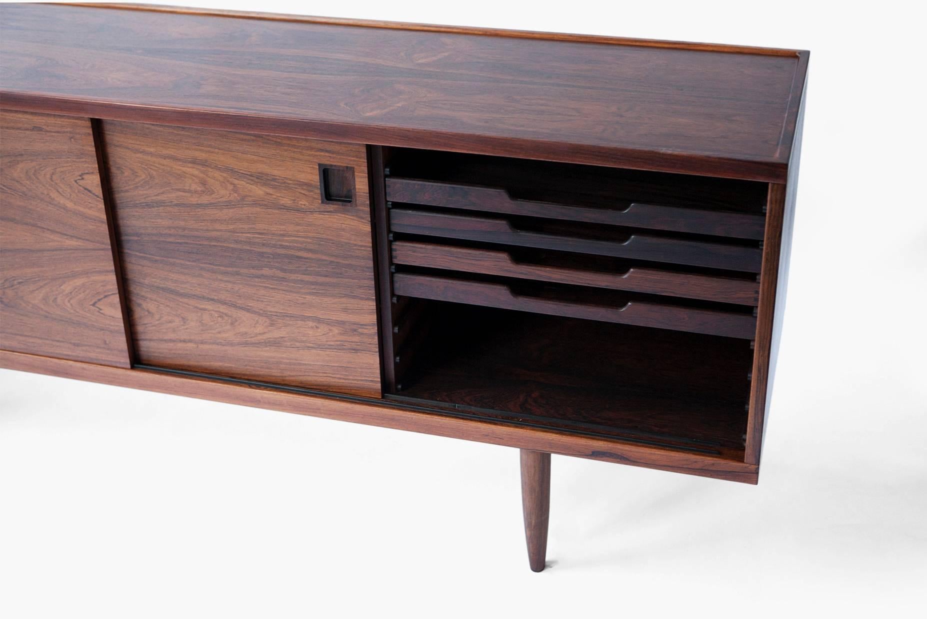 Rosewood sideboard designed to complement Moller's range of dining chairs and tables. Produced by J.L. Mollers Mobelfabrik. Rosewood inlays and solid pull-out drawers.