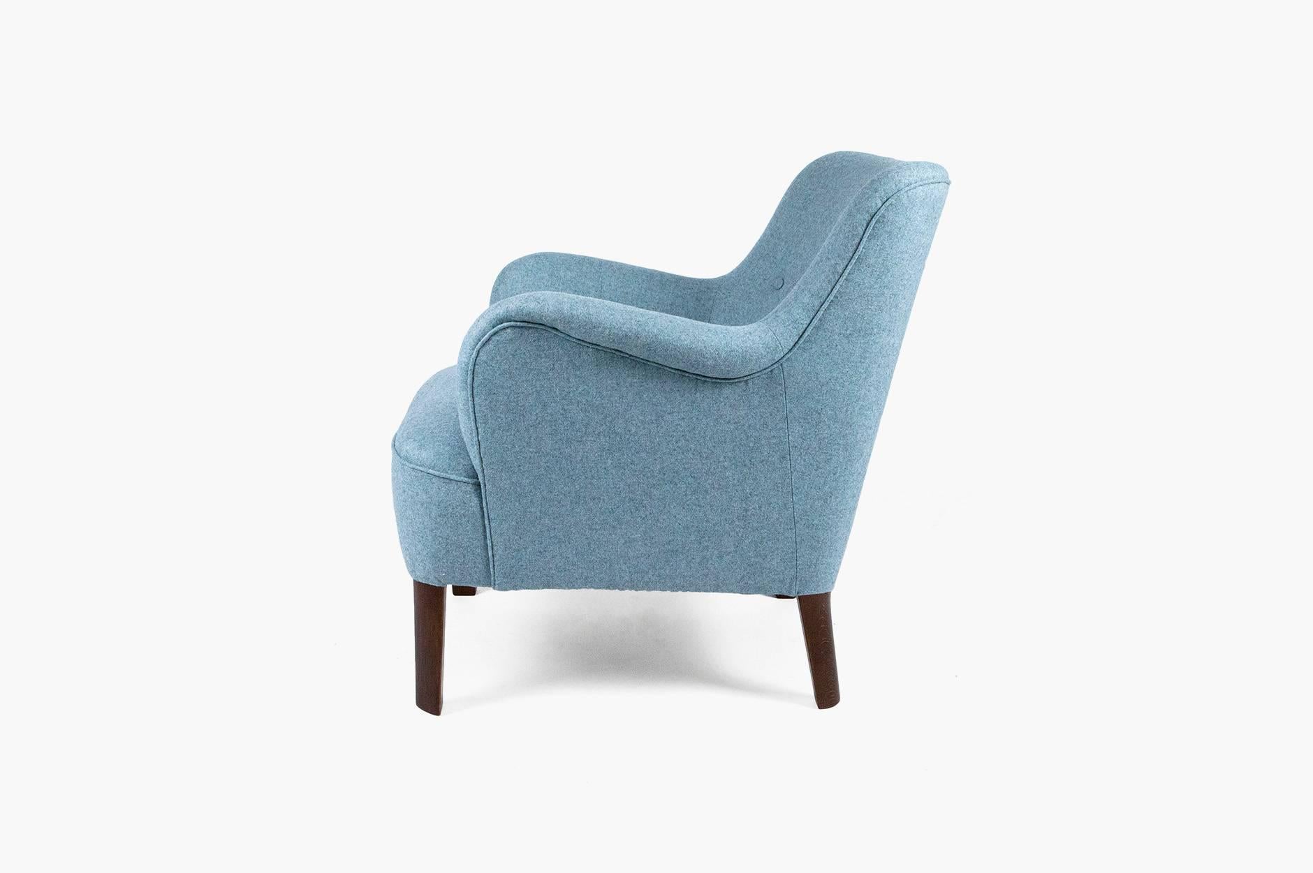 Covered armchair with buttoned-back and stained beech legs. Reupholstered in blue-green Moons and Son British wool felt.