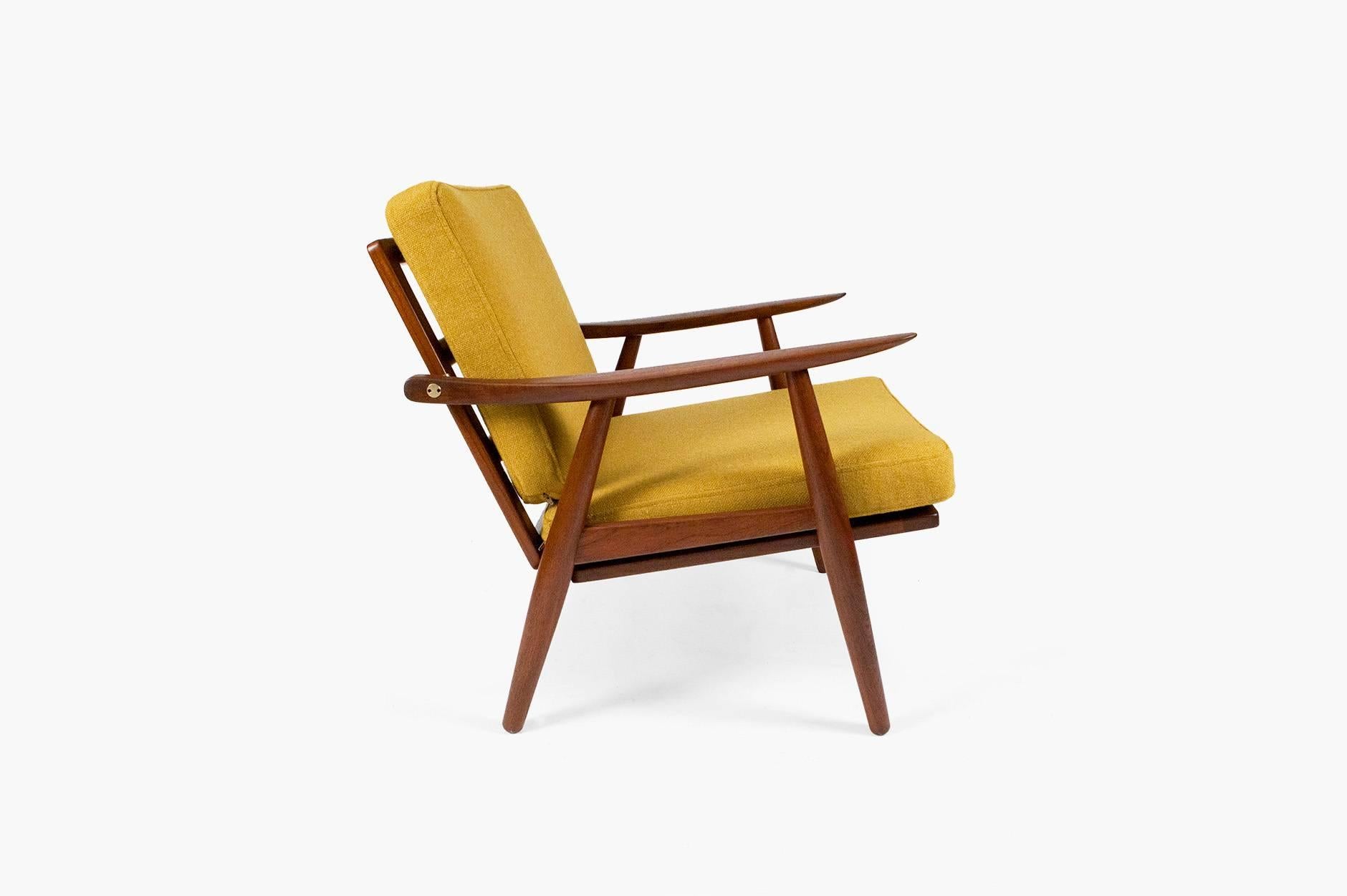 GE-270 lounge chair designed in 1956. Produced by GETAMA, Gedsted, Denmark. Restored teak frame with exposed brass fittings. New cushions covered in mustard yellow Bute wool fabric.
               