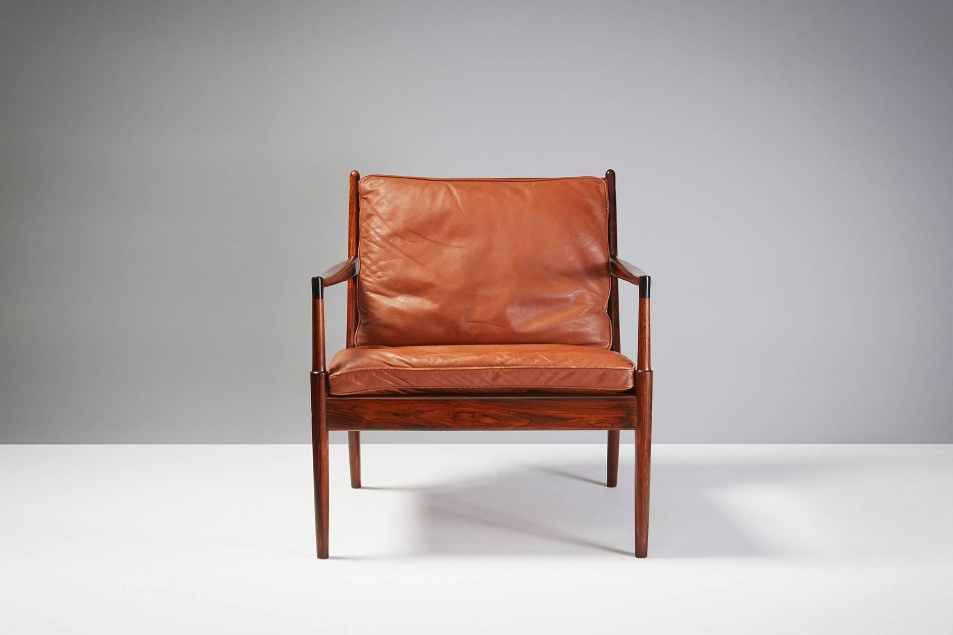 Ib Kofod-Larsen

Pair of 'Samso' lounge chair, circa 1960s

Rare model lounge chairs produced for Olof Perssons Fatoljindustri (OPE), Jonkoping, Sweden. Original leather cushions and highly figured, unusual rosewood frame.

 