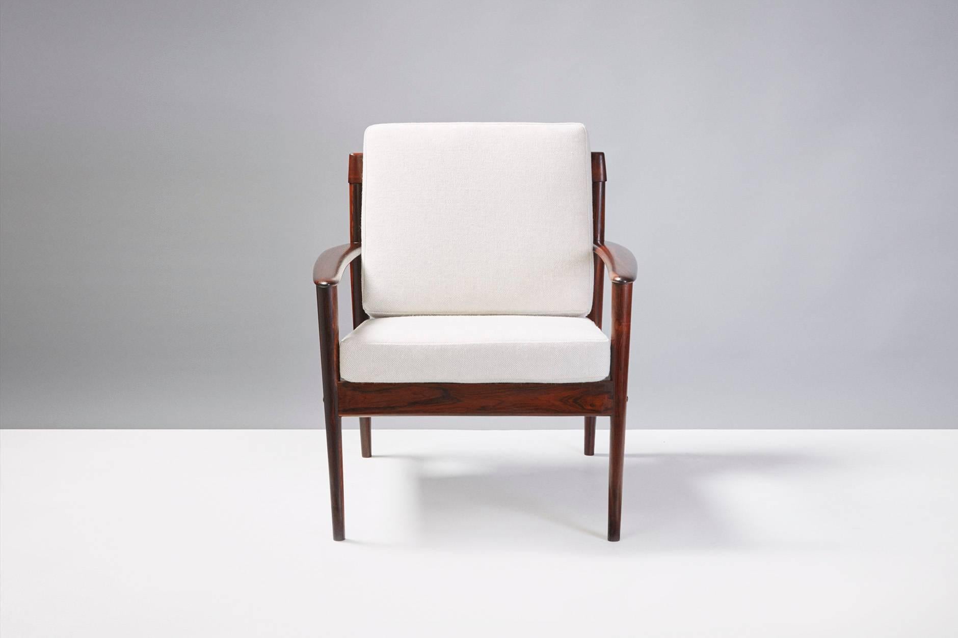 Produced by Poul Jeppesen, Denmark. Beautiful, solid rosewood frame, new cushions covered in Kvadrat Hallingdal #103 fabric. Rarely seen model from one of Denmark's finest designers.


 