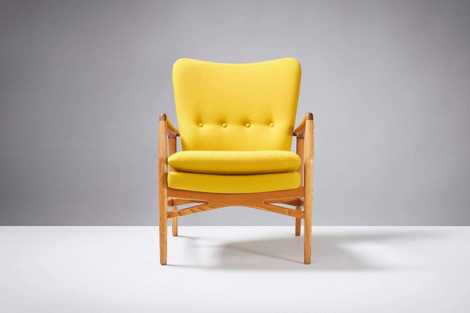 Produced by Slagelse Mobelvaerk, Denmark. Teak armrests and beech frame. Seat reupholstered in yellow Kvadrat Halingdal fabric.