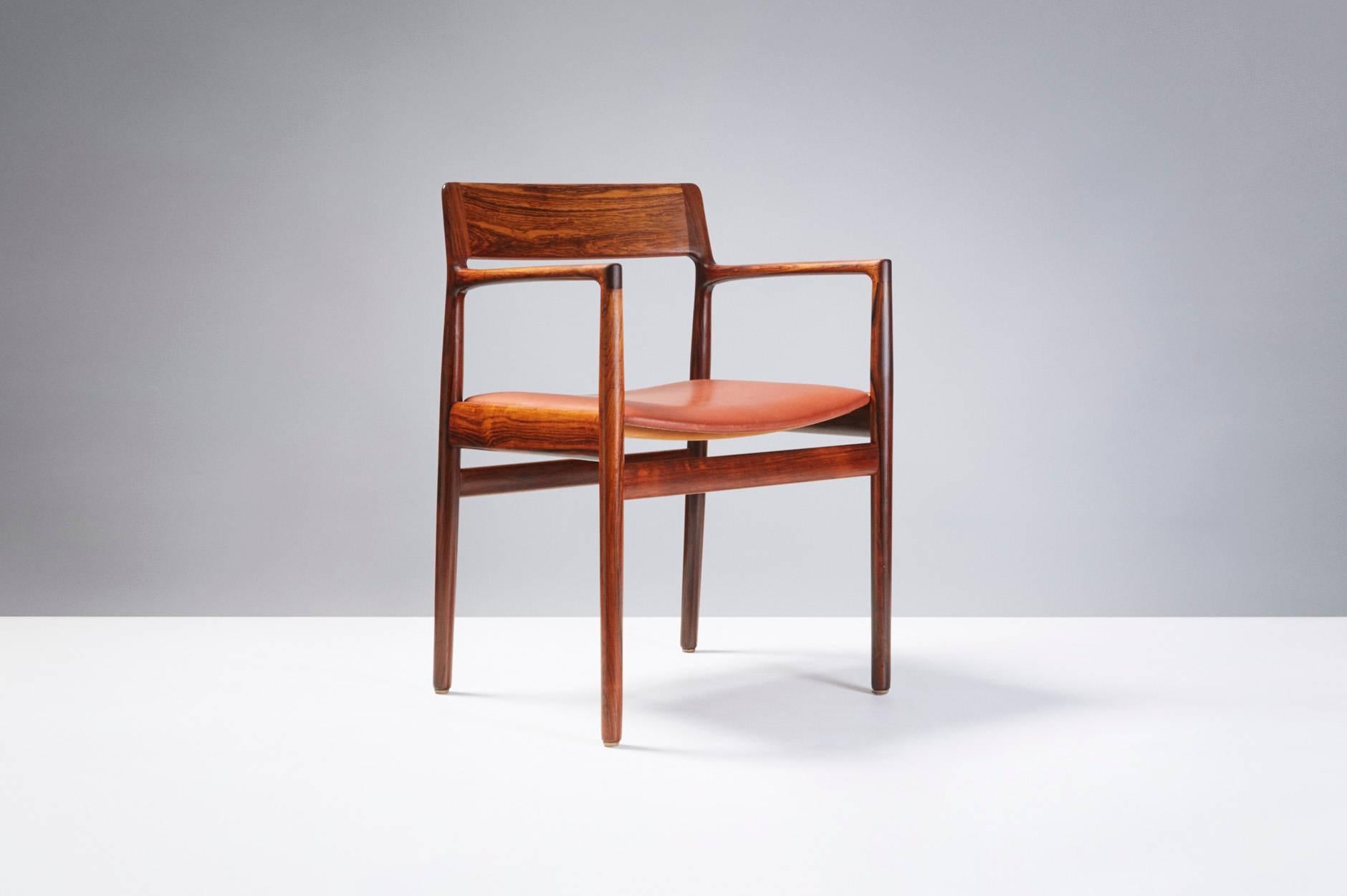 Rosewood armchair produced by Norgaard Mobelfabrik, Denmark. Original brown leather seat.