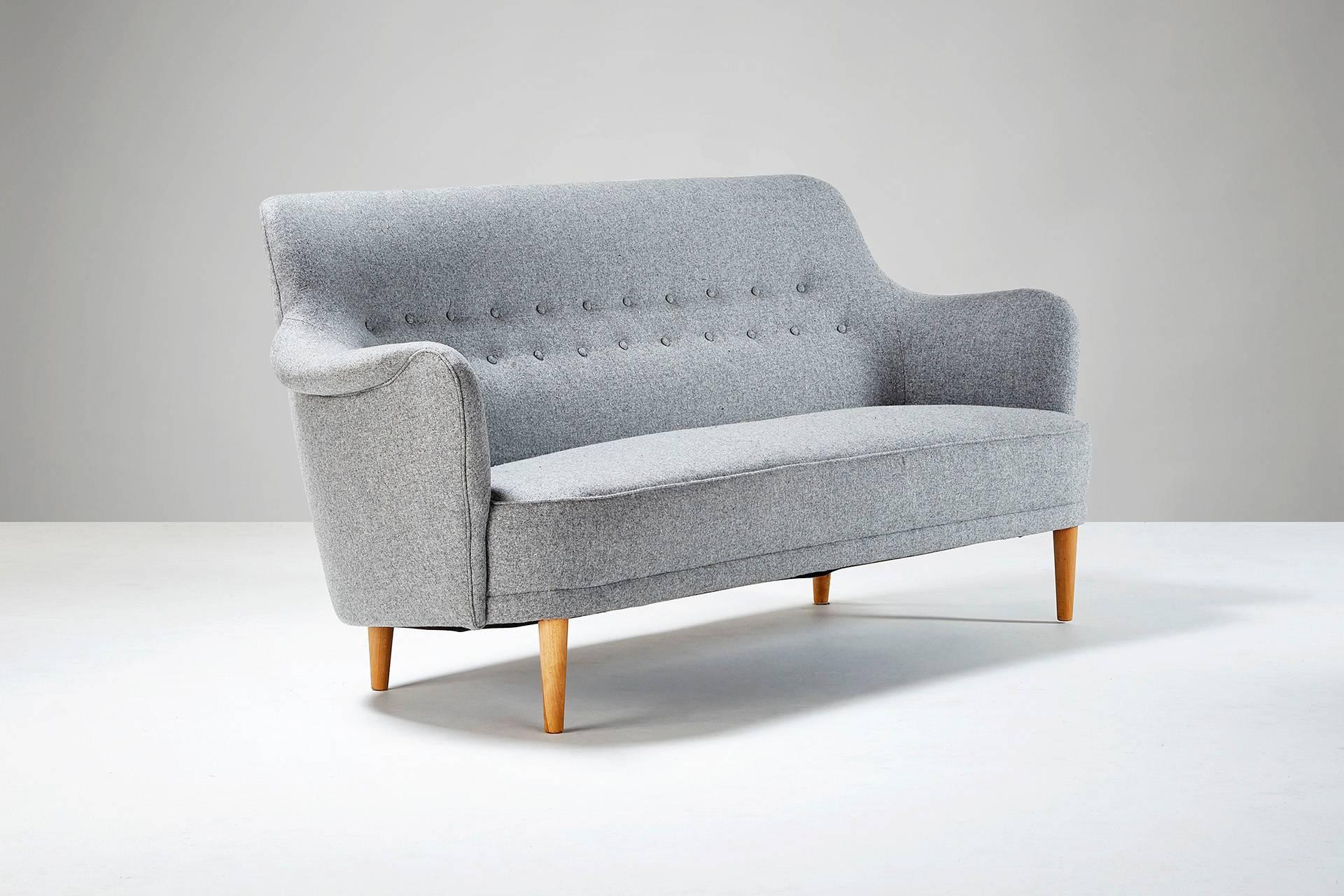 First designed in 1923 for the Stockholm Concert Hall. Produced by O.H. Sjogren, Sweden. Reupholstered in Melton wool fabric from Abraham Moon. Oiled beech legs.