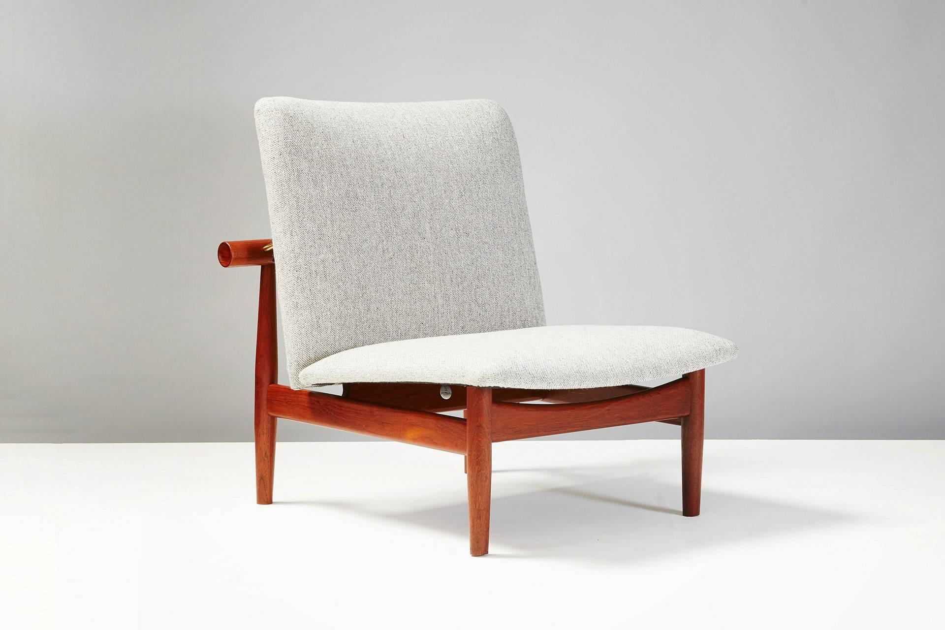 Produced by France & Son, Denmark. Solid teak frame, exposed brass fittings. Seat and back pad reupholstered in Kvadrat Divina wool fabric. Highly sought after model inspired by the Miyajima water gate near Hiroshima.