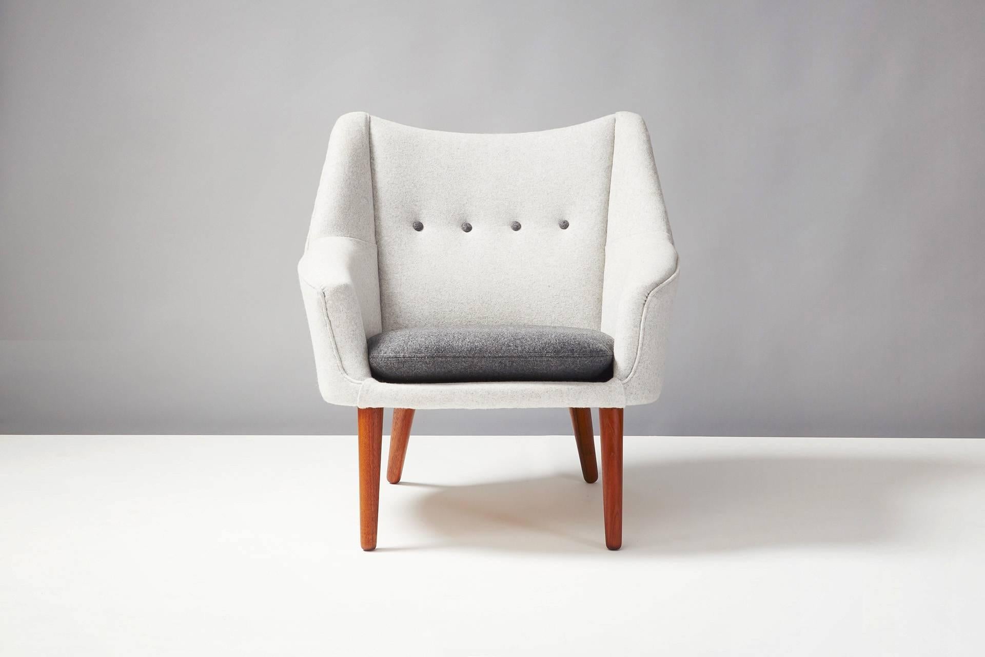 Produced by Rolschau Mobler, Denmark. Teak legs, seat and loose cushion reupholstered in Kvadrat Divina wool fabric.