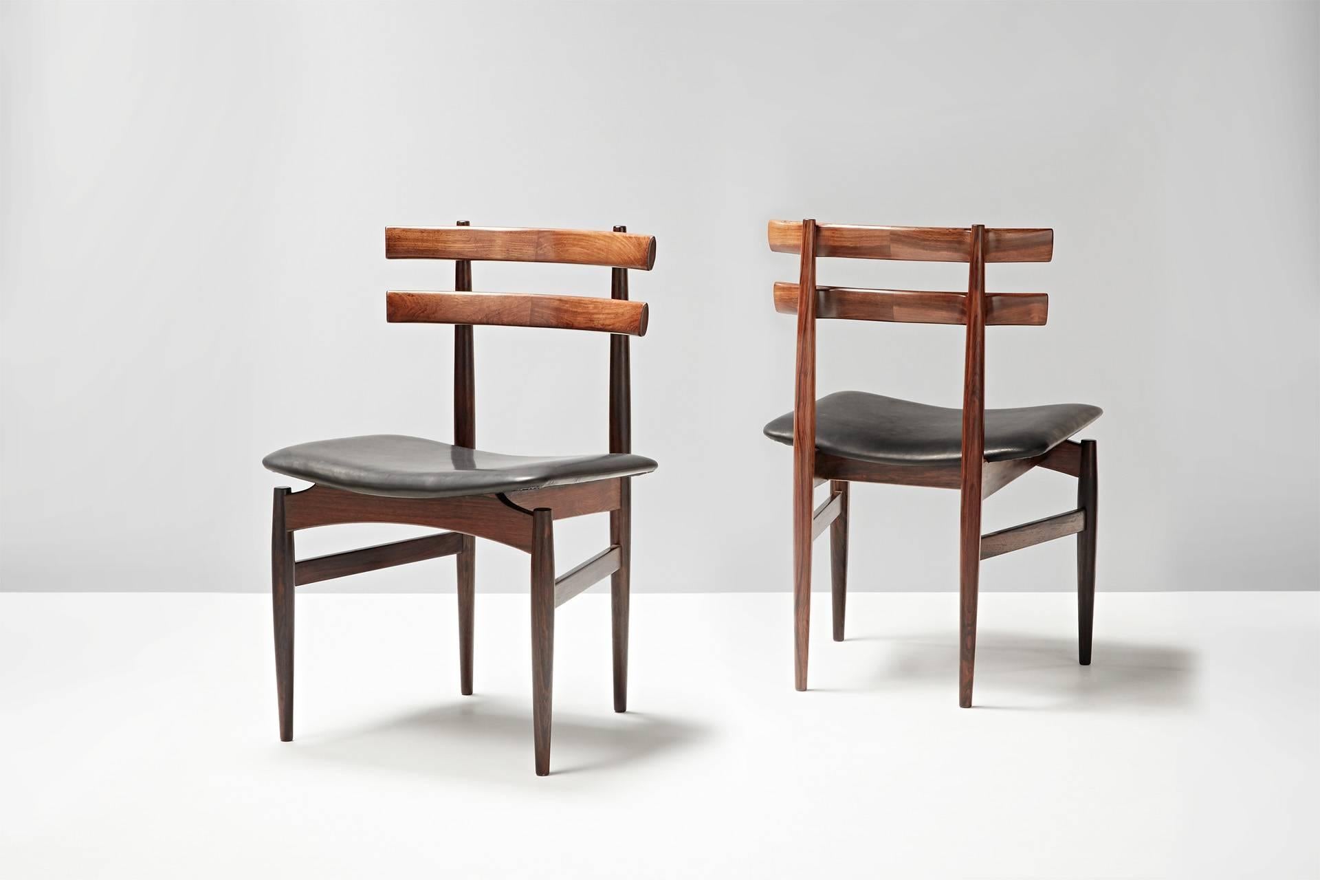 Set of six rosewood dining chairs by Poul Hundevad. Seats newly covered in aniline black leather.