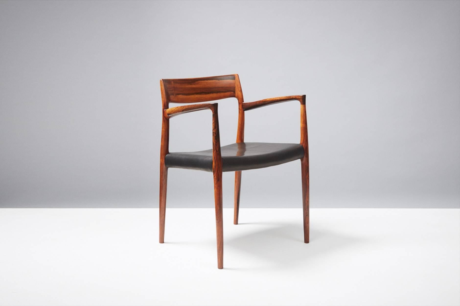 Rarely seen example in Brazilian rosewood, produced by J.L. Moller Mobelfabrik, Denmark, 1959. Seat reupholstered with black aniline leather.