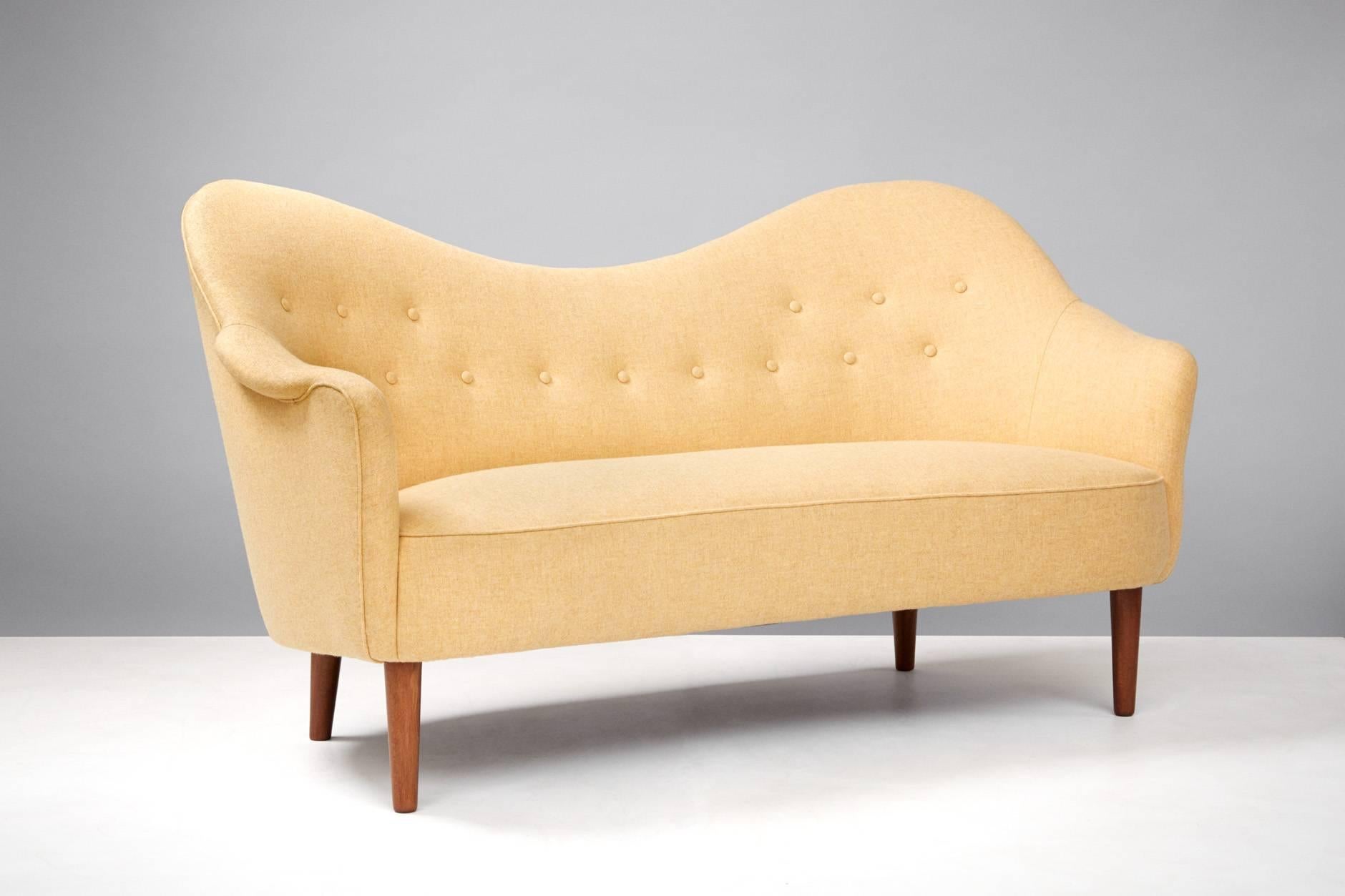 First designed in 1956 and produced by AB Record, Bollnas, Sweden. Reupholstered in Melton wool fabric from Abraham Moon. Stained beech legs.