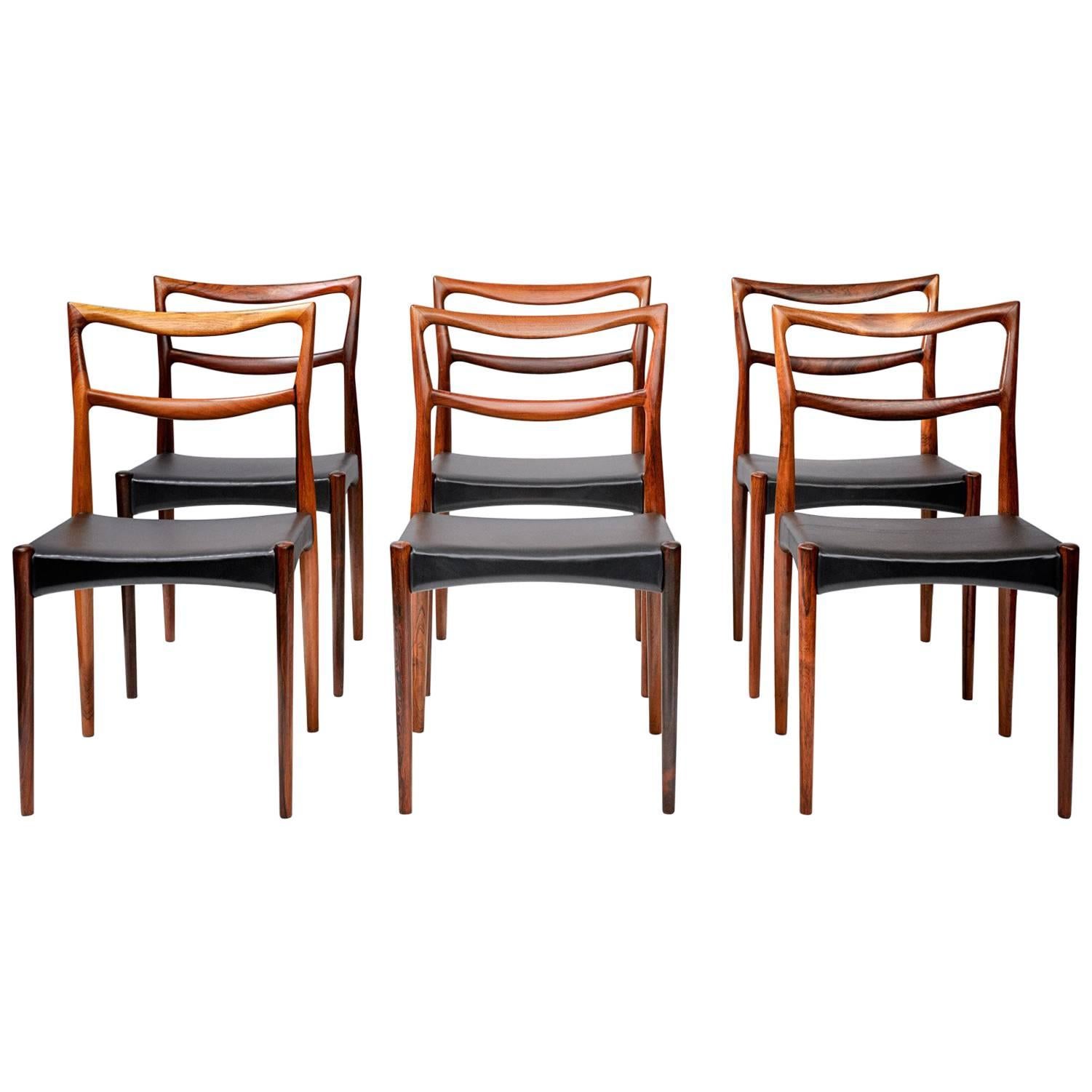 Johannes Andersen

Vintage Dining chairs, circa 1960.

Set of eight dining chairs produced by Christian Linnerberg, Denmark. Seats newly reupholstered in black leather. 

 