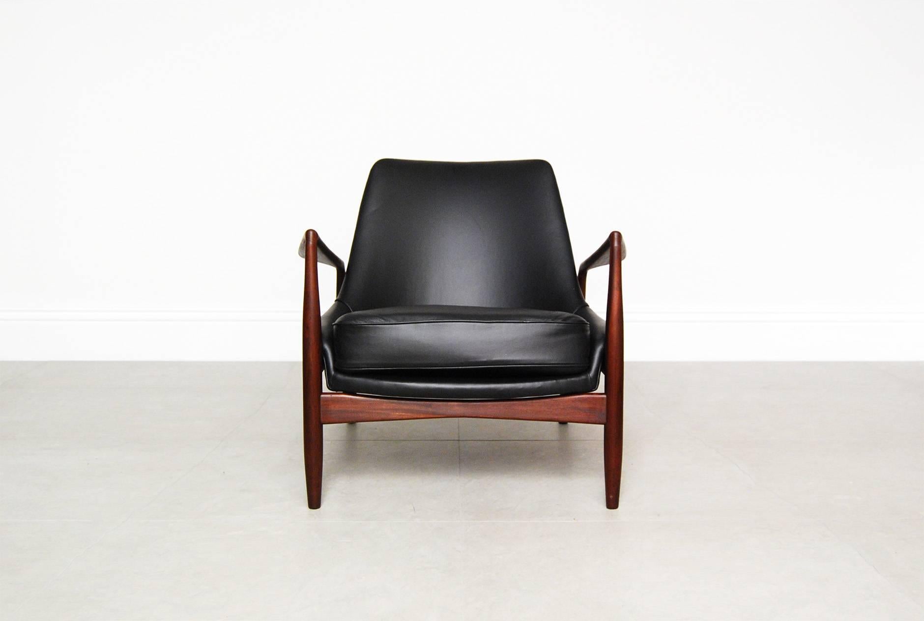 Rare and highly collectable piece from Danish master Ib Kofod-Larsen for Swedish manufacturer OPE. The 'Salen' or 'Seal' chair was designed and made in the late 1950s. This example comes in rich, oiled Afromosia teak. The seat and loose cushion have