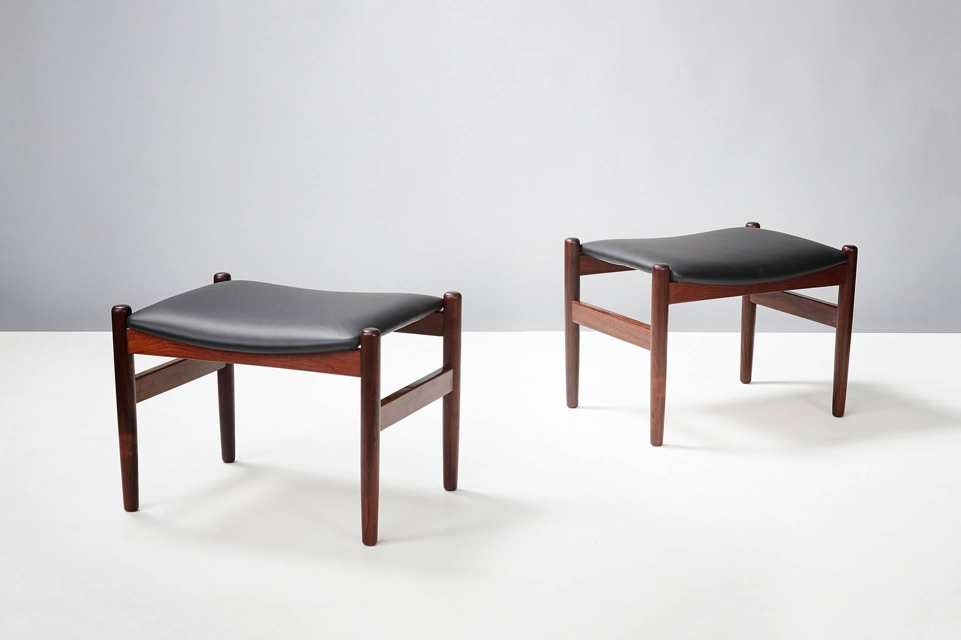 Pair of rosewood stools by an unknown Danish designer. Seats reupholstered in new black leather.