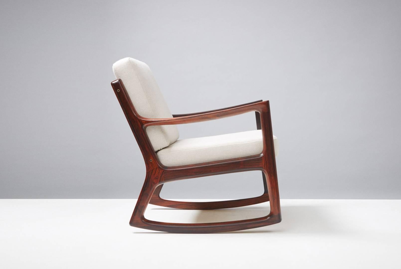 Rare rosewood edition of the 'Senator' rocking chair, circa 1960. Produced by France and Son, Denmark. Solid Brazilian rosewood. Includes maker's stamp and badge. New cushions covered in Kvadrat Hallingdal #103 wool fabric.