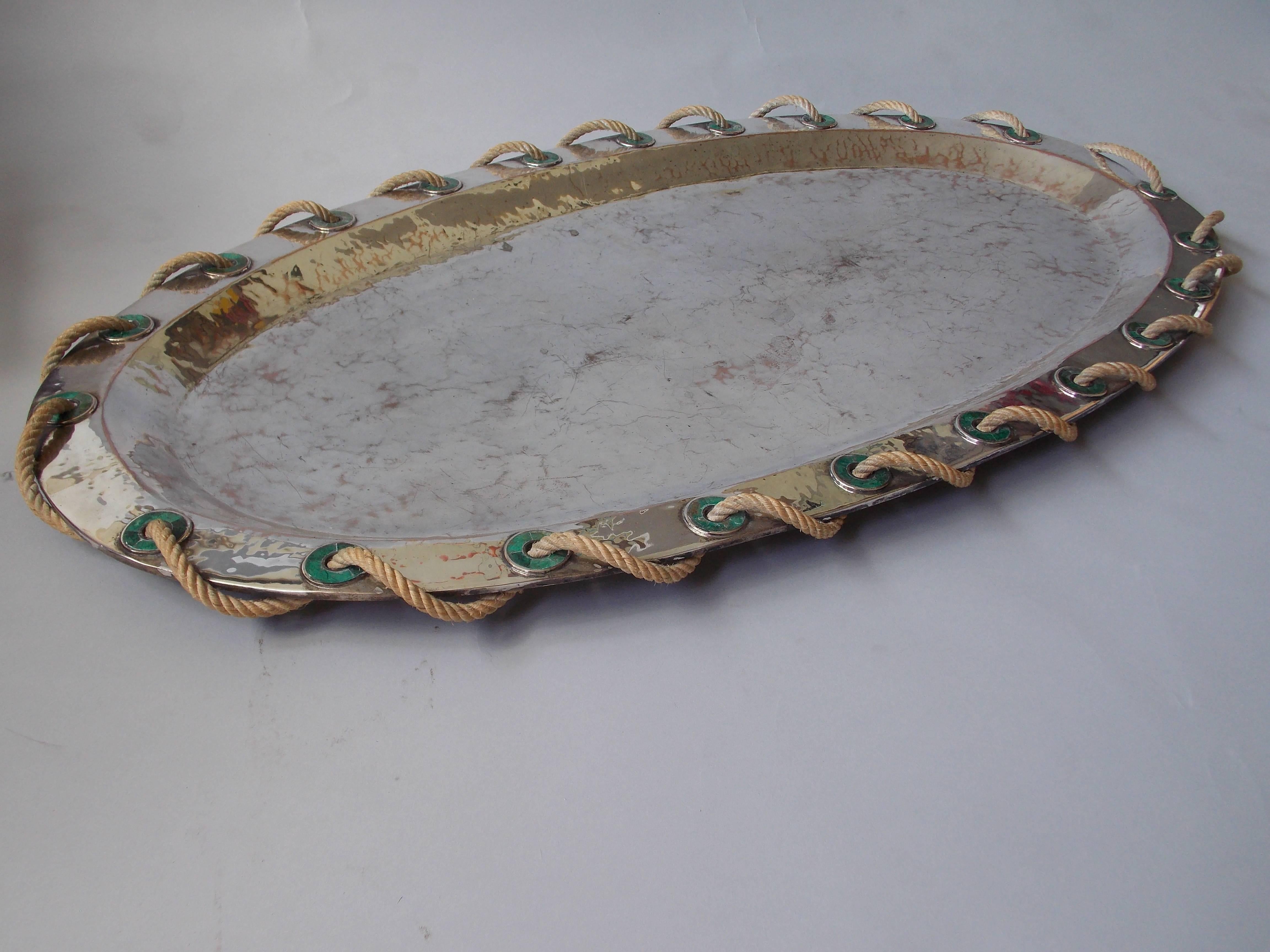 A nice big decorative tray.
Hand-hammered brass with silver plating, malachite stone and rope detailing.
It's stamped on the bottom with hallmarks.
It has the original wear or patina consistent with age, no damage.
It will look great on a large