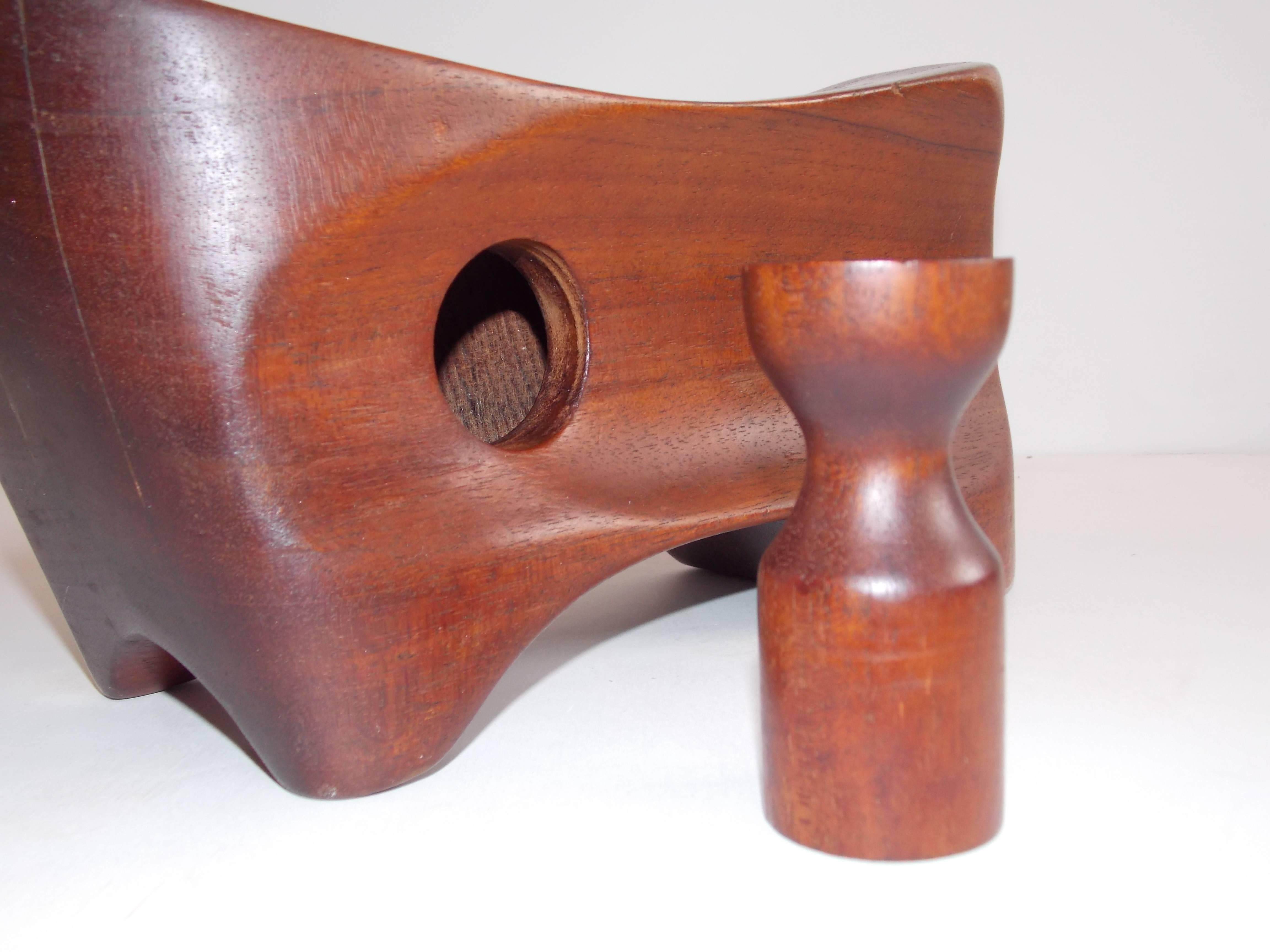 nice sculptural form and function design
handmade mahogany wood


 