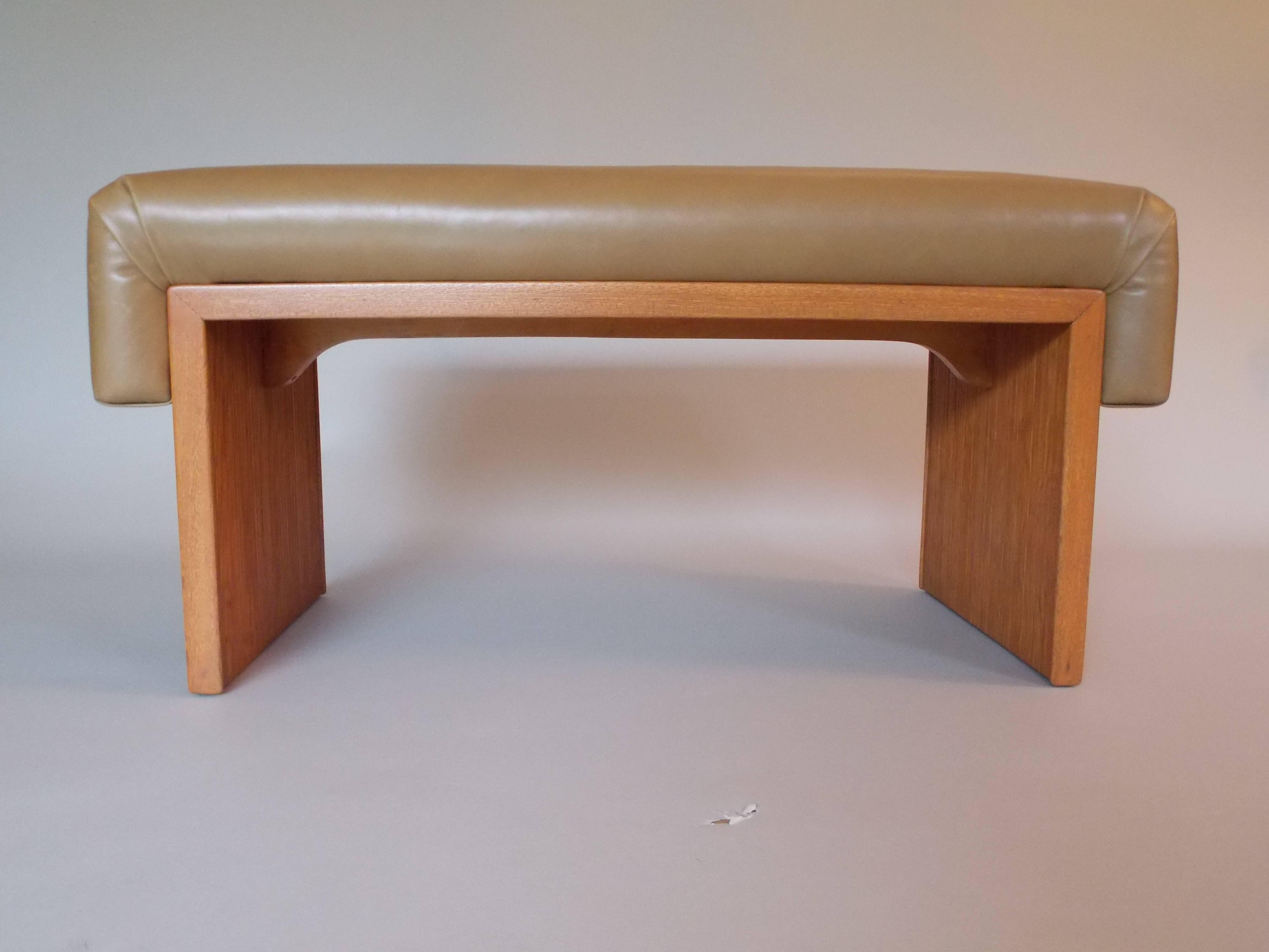 A nice modernist design.
Made of combed oak wood (lightly refinished without taking away from its' historical integrity) with chic tan leather.
It also has the original screws.
This design and scale is great to use anywhere in the home.
It was