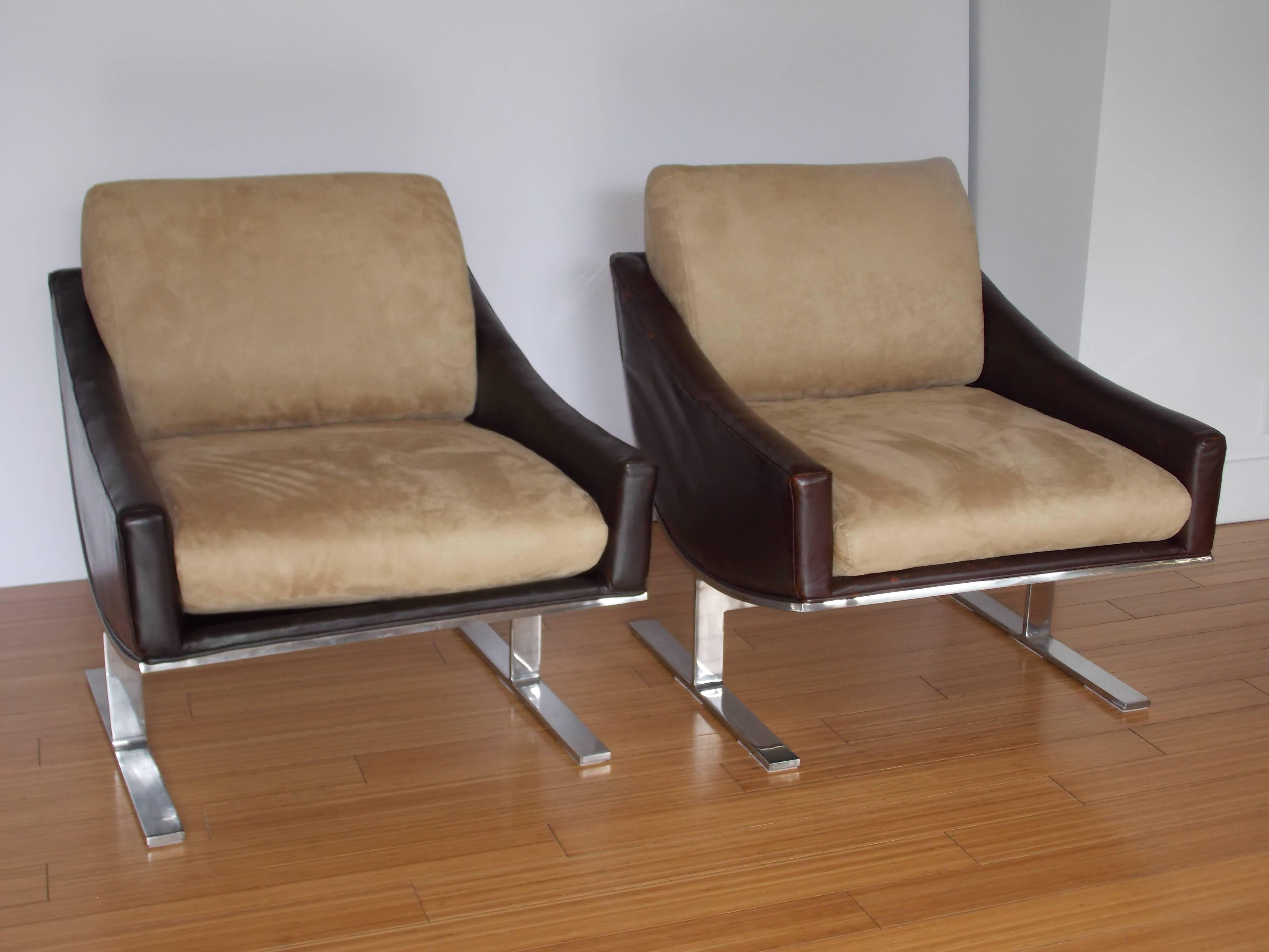 A nice pair of timeless designs. 
The have the original brown leather that shows ware consistent with age, with new upholstered ultra suede cushions in great condition.
The base is made of nickel-plated steel with minor ware.
These are sturdy and