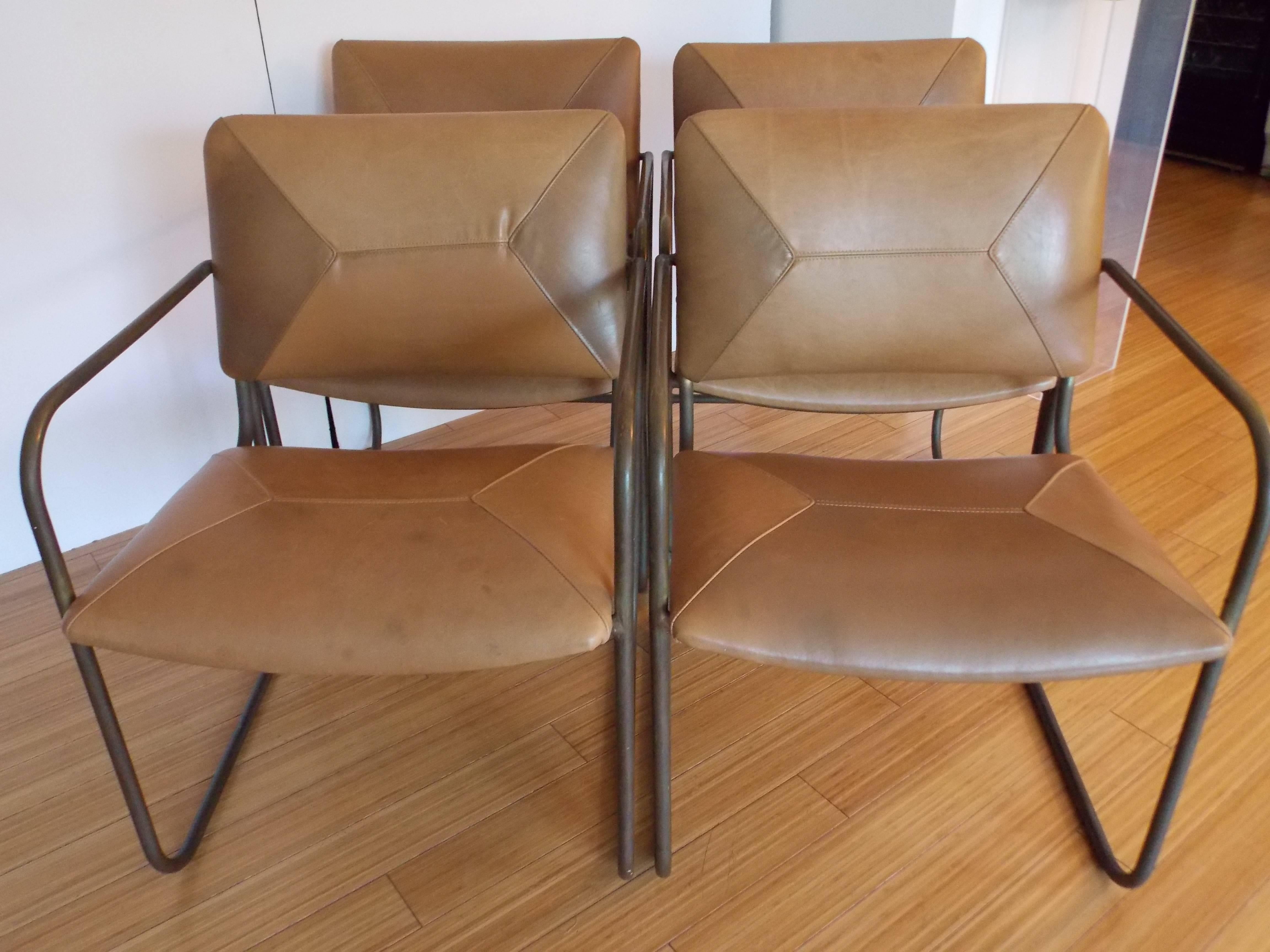 A nice set of modernist designs.
These are great to use for any type of seating arrangement, for dining or for an office or studio interior.
They are made of bronze and reupholstered with recycled leather.
The leather shows minor ware and patina