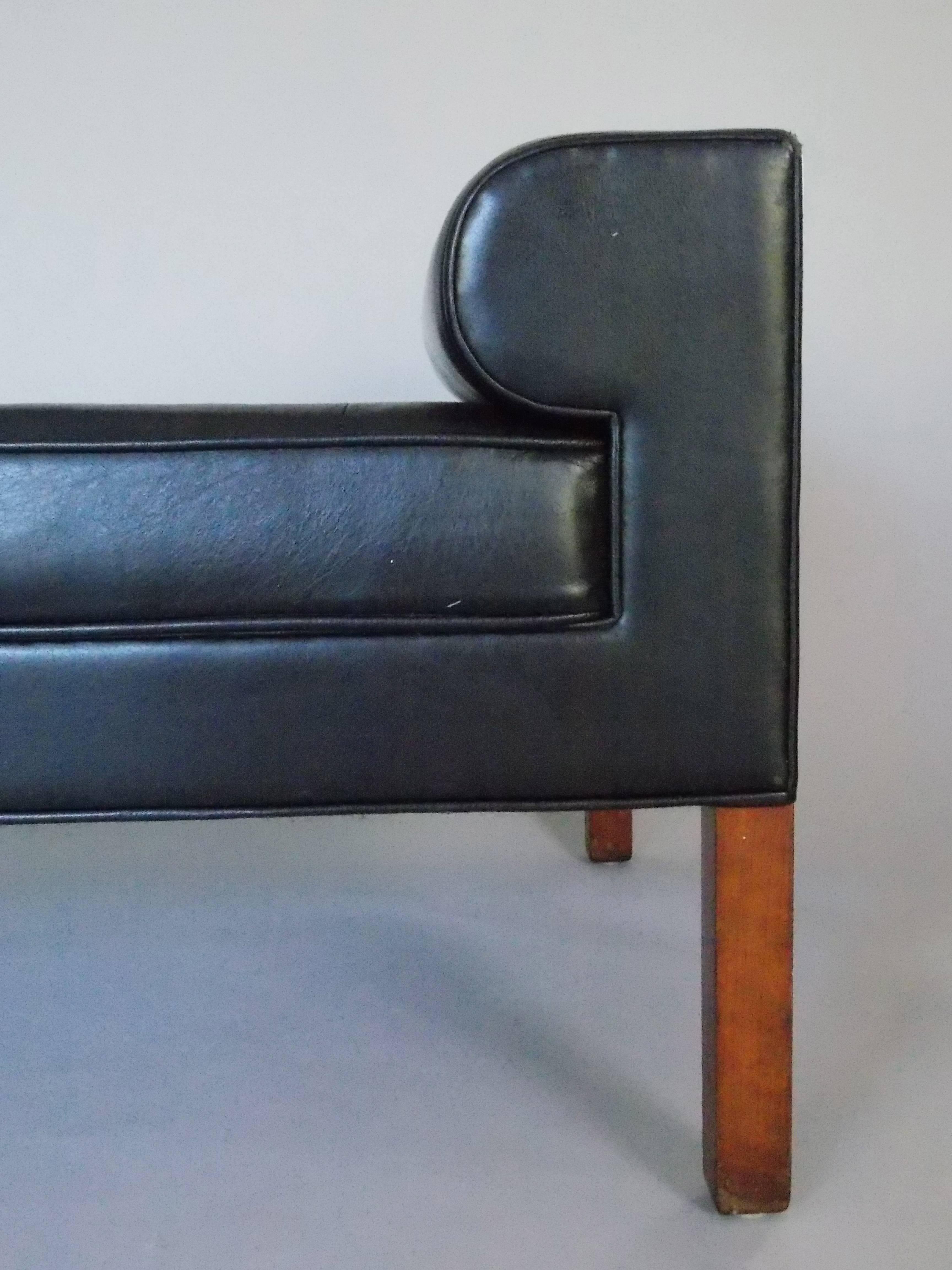 A nice architectural design.
Quality made.
Wood construction with upholstered leather and walnut legs.
It's in the original vintage condition showing ware consistent with age, some scuffs, no major damage.
It can be reupholstered or left as is. We