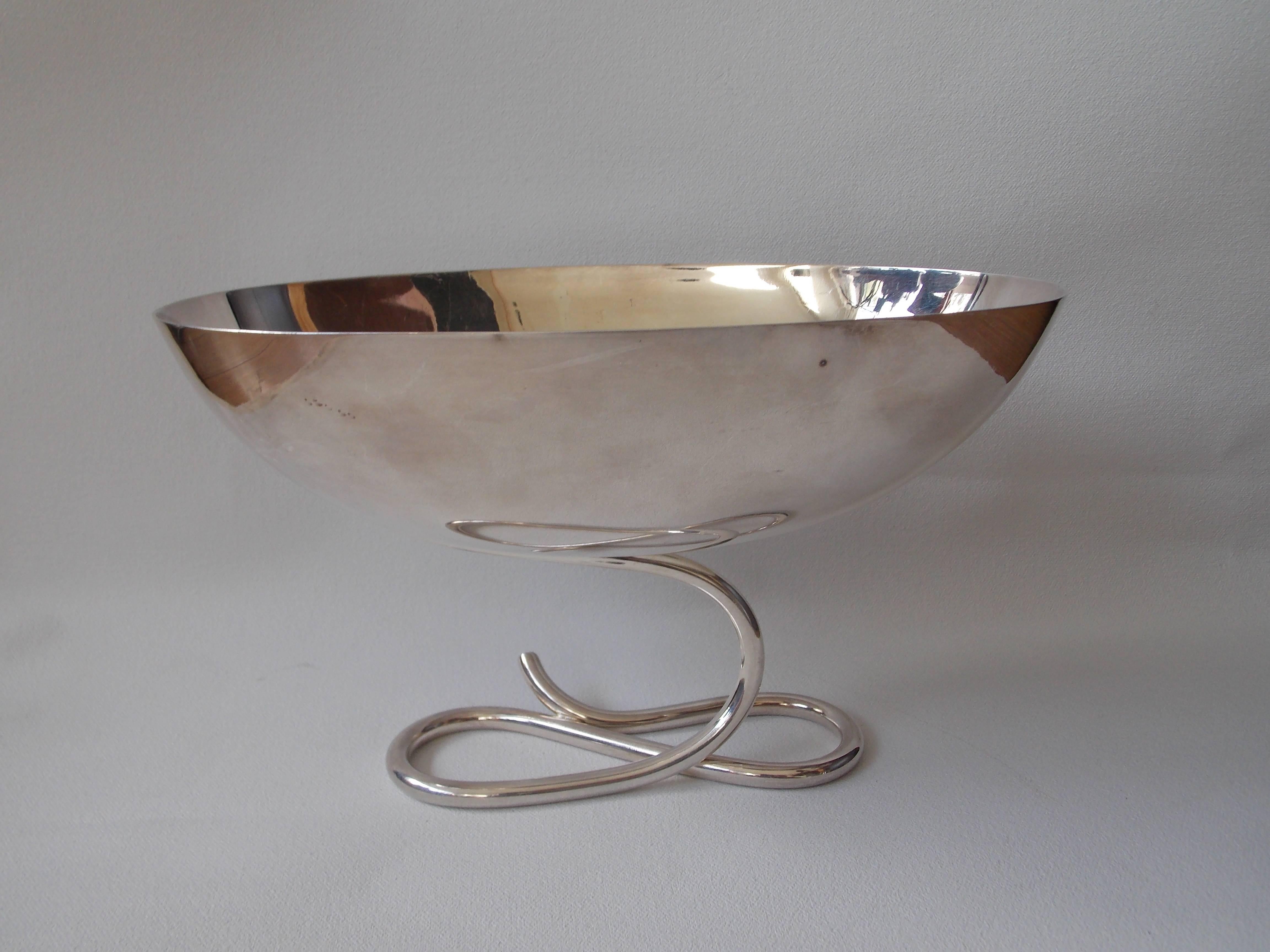 A great silver plated brass design with sculpted serpentine base.
Stamped on the base "Sabattini made in Italy".
It has not been polished and shows minor ware with patina consistent with age.
No damage.
In excellent vintage condition.
    
