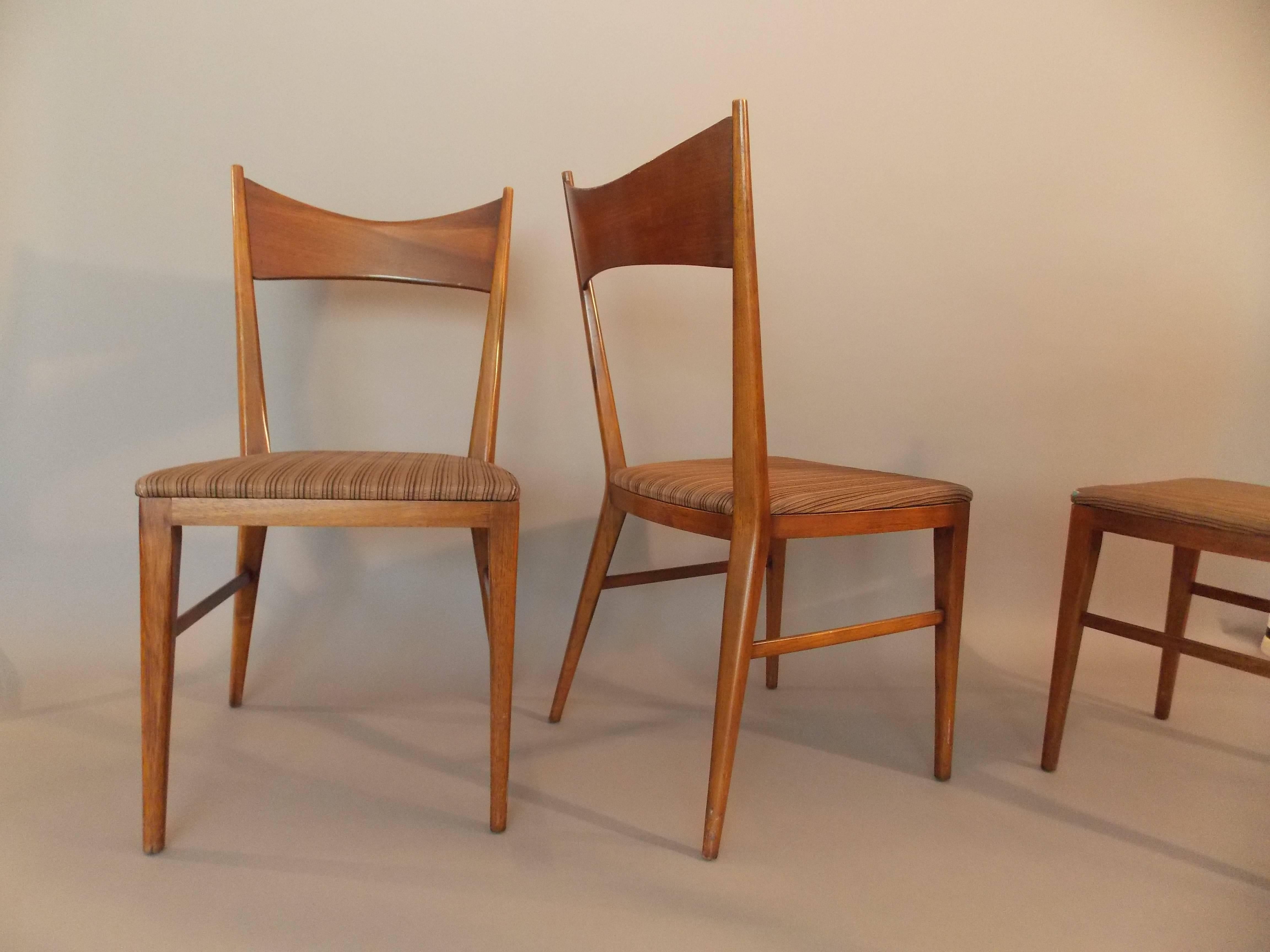 A nice set of modern designs. 
Made of walnut wood with upholstery.
They are in the original vintage condition showing minor ware consistent with age.
The wood has a beautiful patina, but the seats can use a new upholstery.
No major damage.
Solid