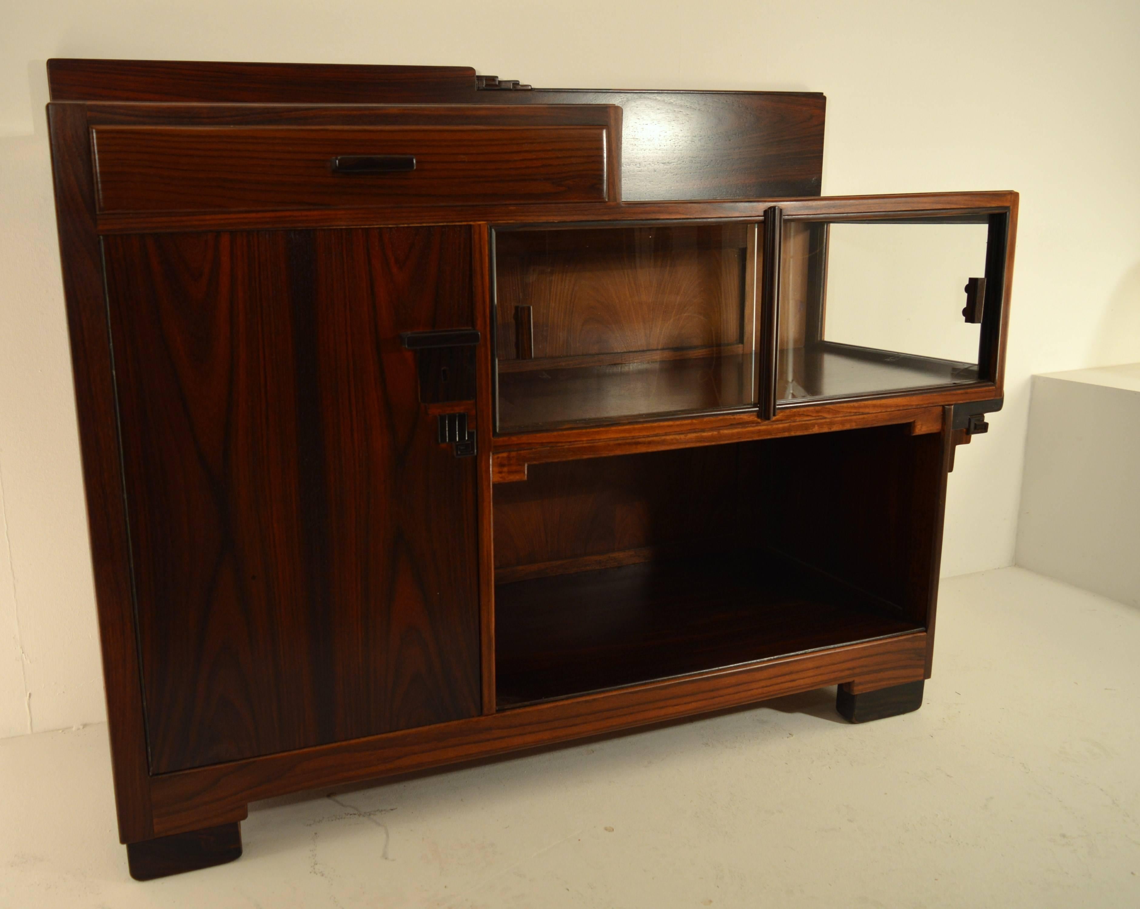 Art Deco rosewood tea cabinet in school of Amsterdam style 1930s. This cabinet has his typical Chinese influences and elements carried out in ebony.
Perfect restored condition.
   