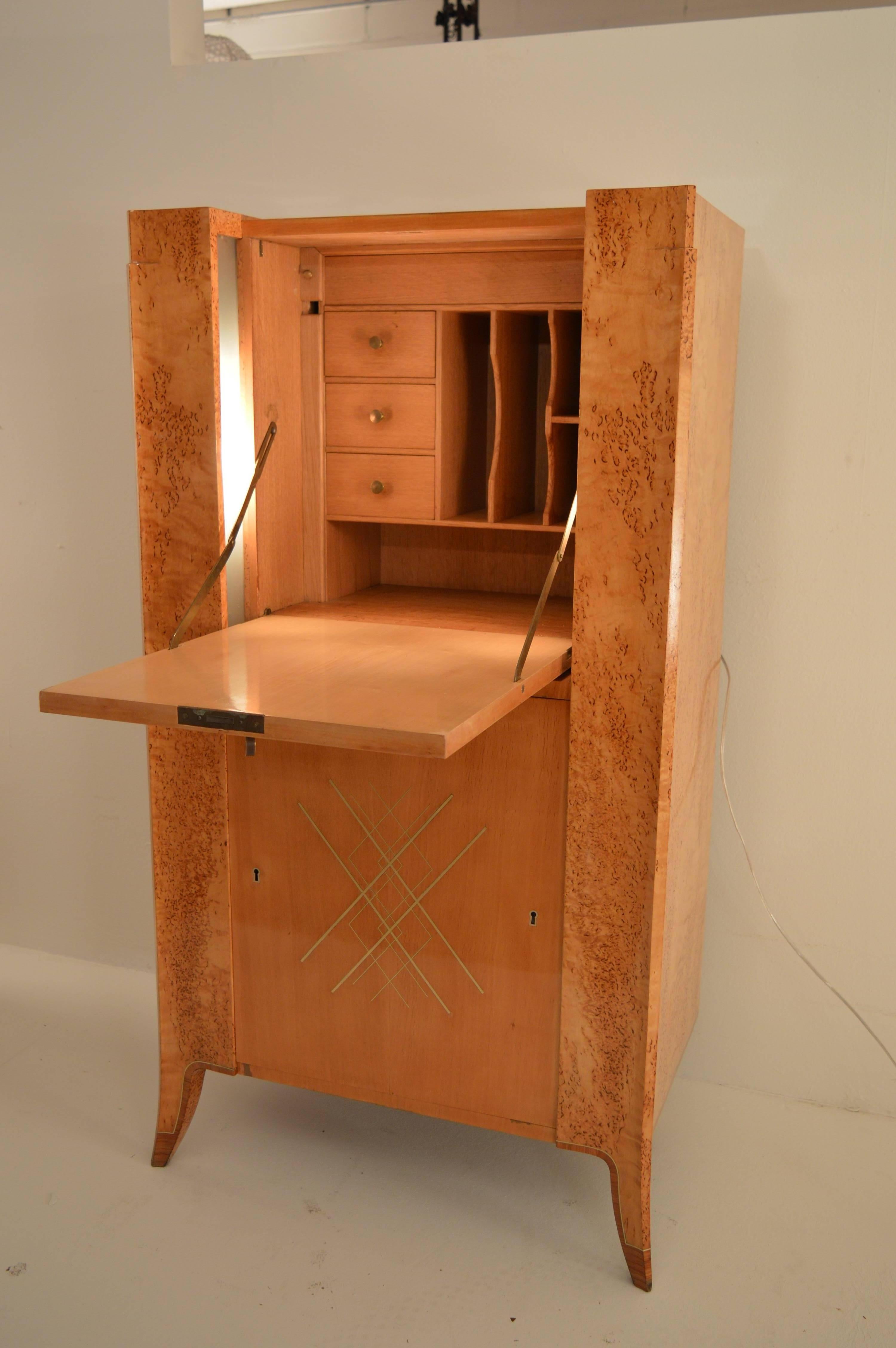 Extremely elegant secretary in Norwegian Silverbirch, signed and dated by F. Mignolet, 1948 ,from Liege in Belgium. This beautiful piece of furniture has intarsia in several woods and inlayment of copper executed in a very high level of