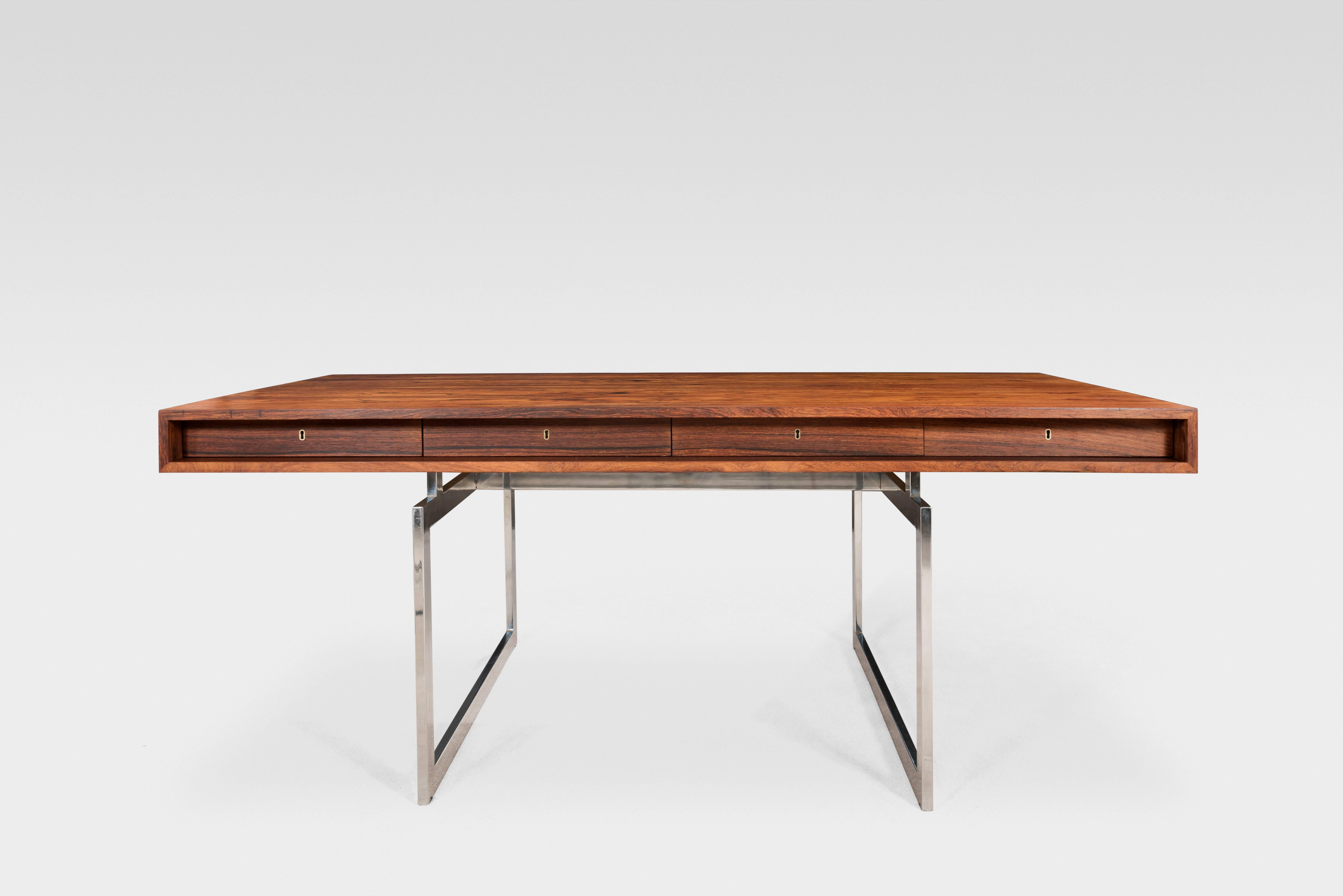Bodil Kjær (born in 1932)
President Desk 
Manufactured by E. Pedersen & Søn, Rødovre, 1959
Rio rosewood and nickel-plated steel blade

This iconic desk appeared in 3 James Bond movies, hence its nickname.

