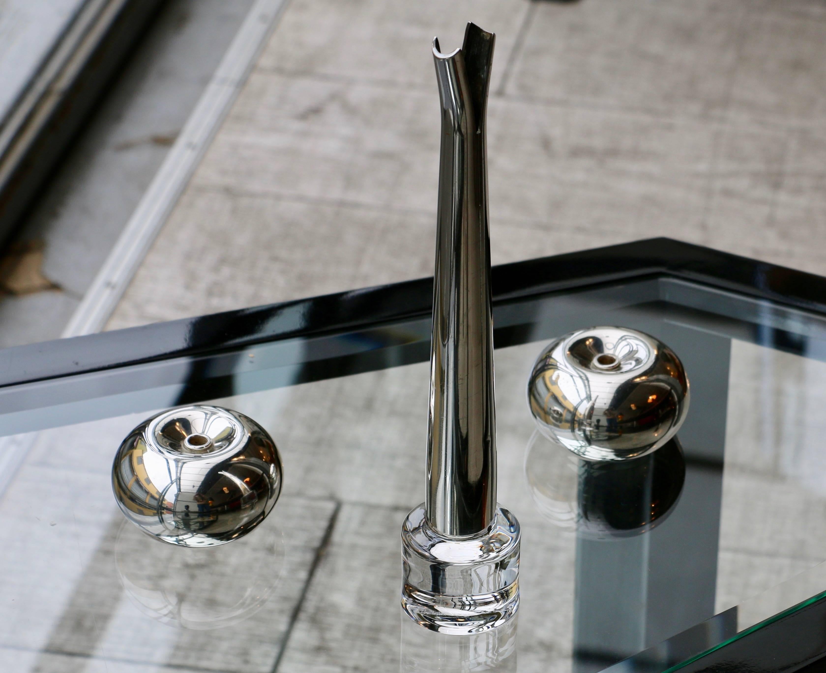 Pair of silvered metal candleholders by Sabattini.
Italy, 2000.