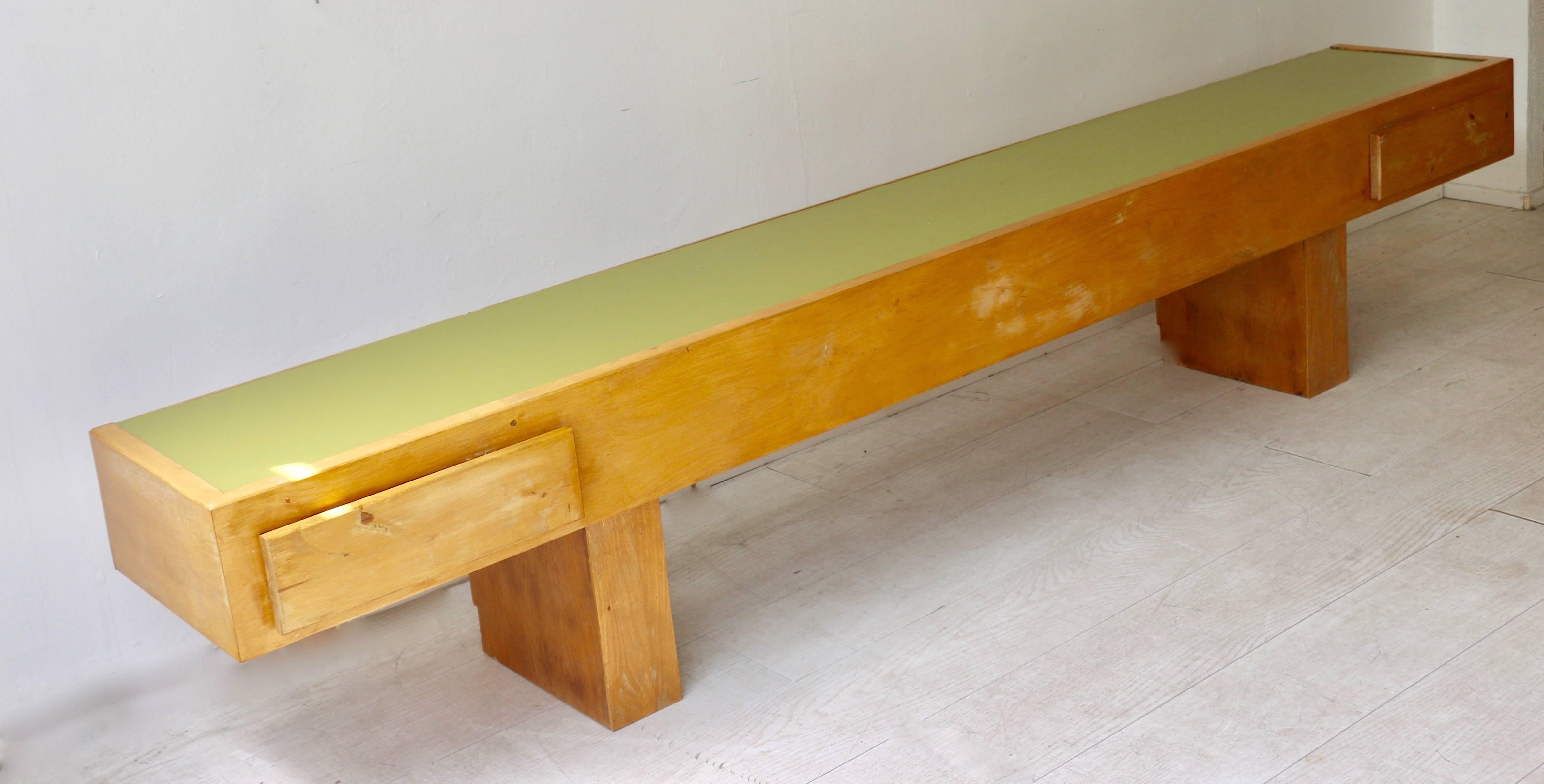 1960s Jaïme Rora, architect, Spain. Large very low console in light wood with a green formica top.