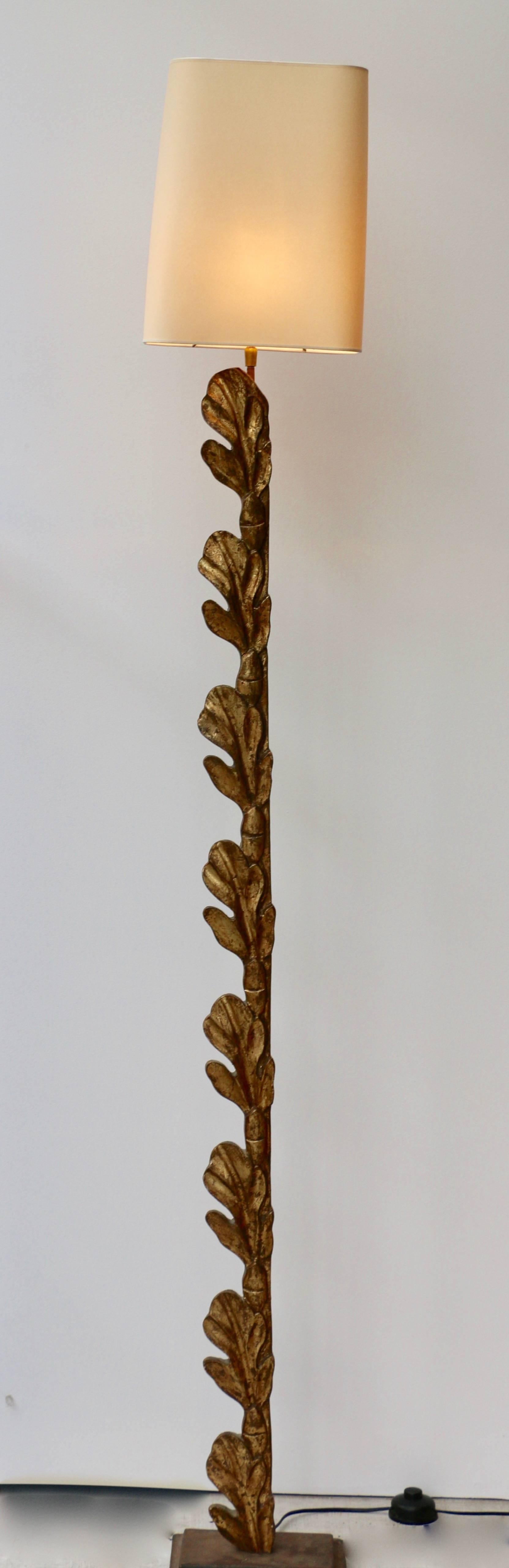 Pair of 1980s floor lamps in giltwood with a foliage decor.
