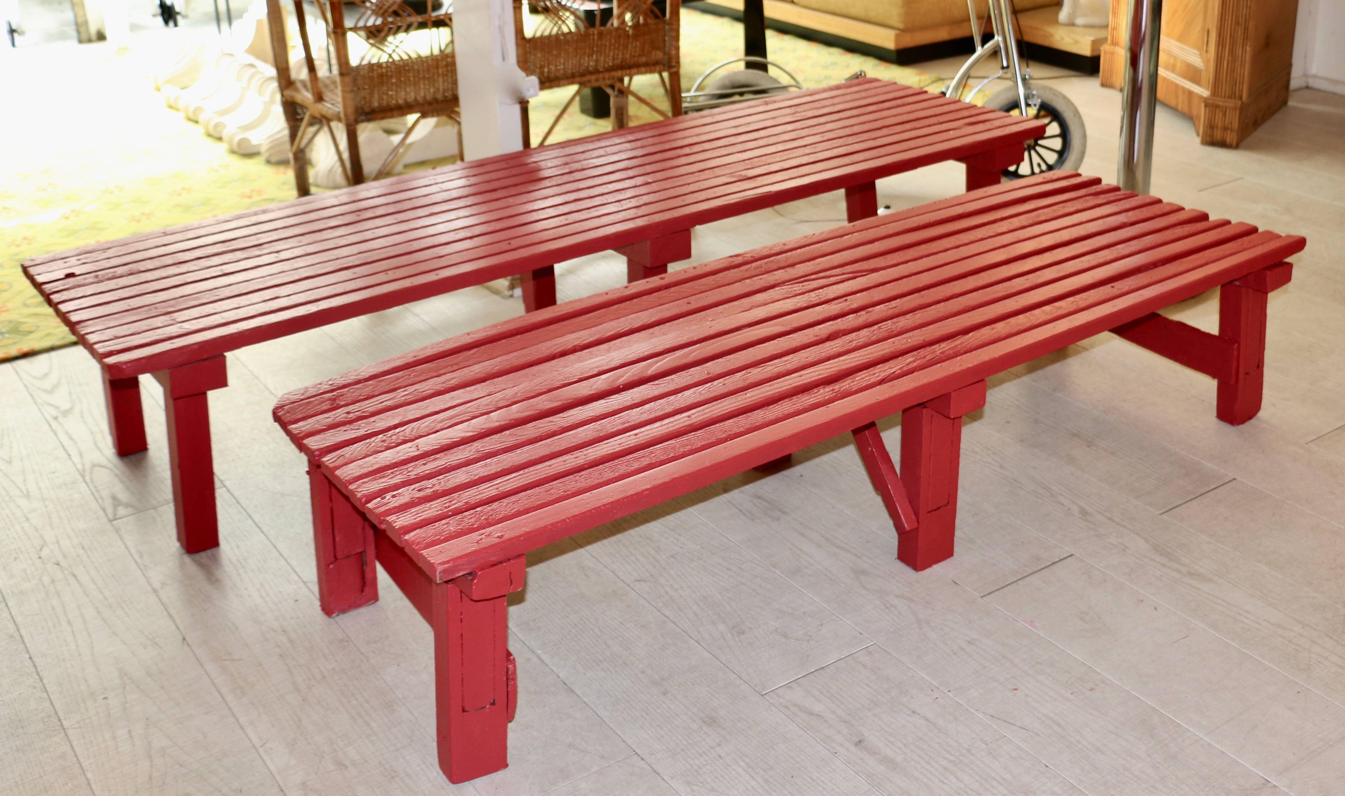 Two large and large benches in painted wood. These benches were used for the presentation of barrels in an Italian wine property. They are repainted in a special outdoor Farrow and Ball red paint.