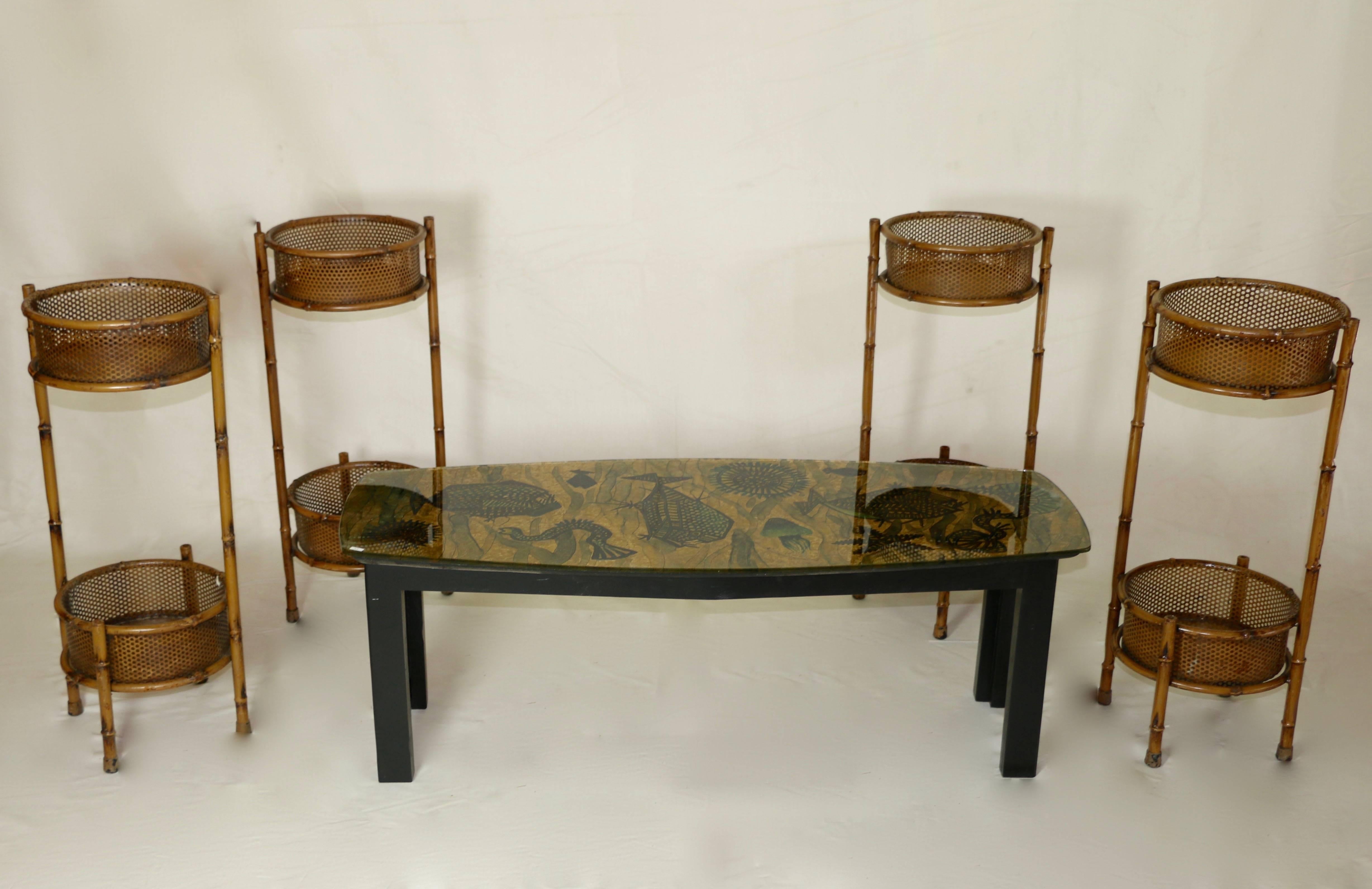 1960s.
Glass top decorated with underwater motifs coffee table. Black painted wood base.