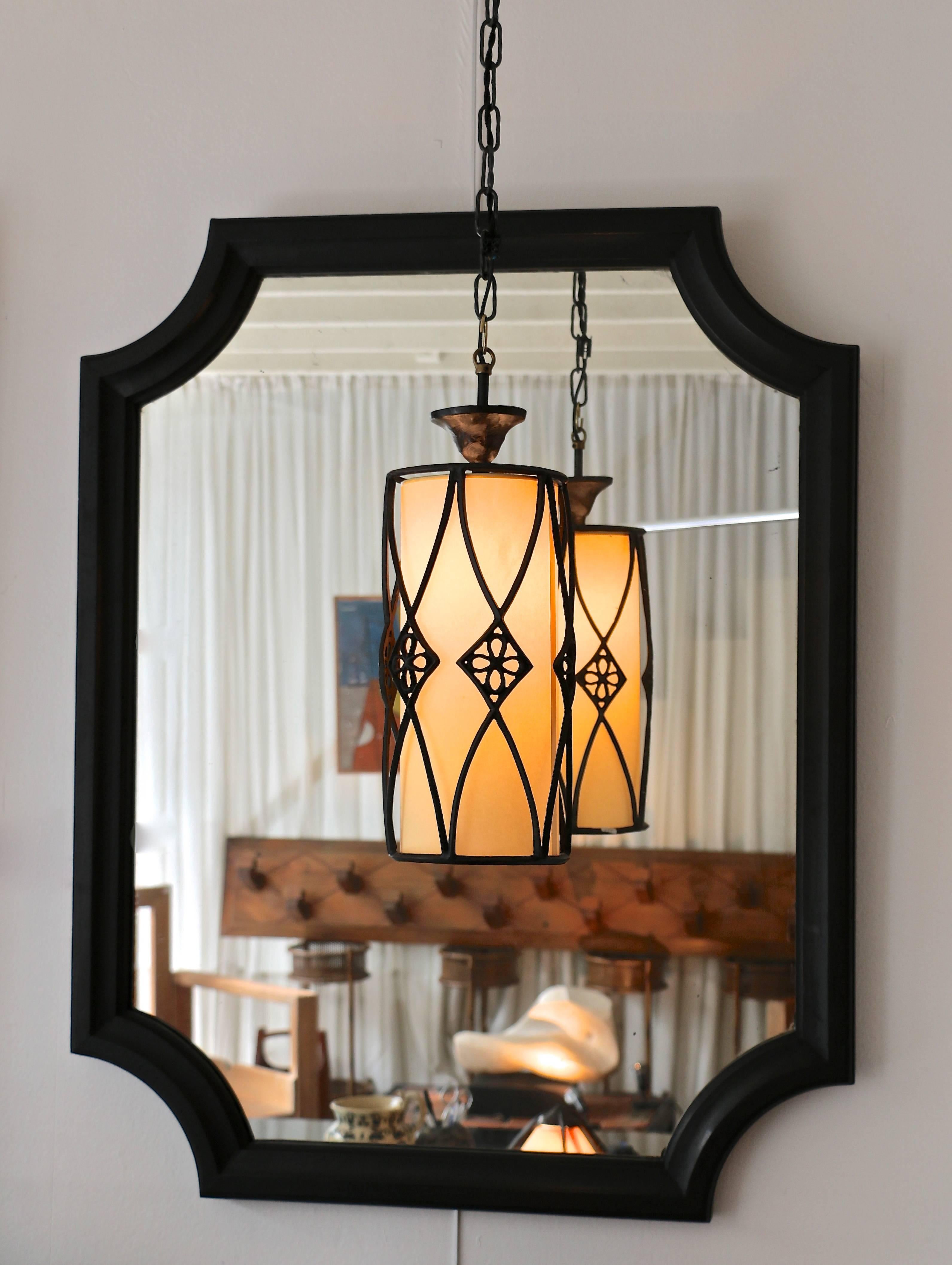 Pair of 19th century mirrors in black tainted carved oak.