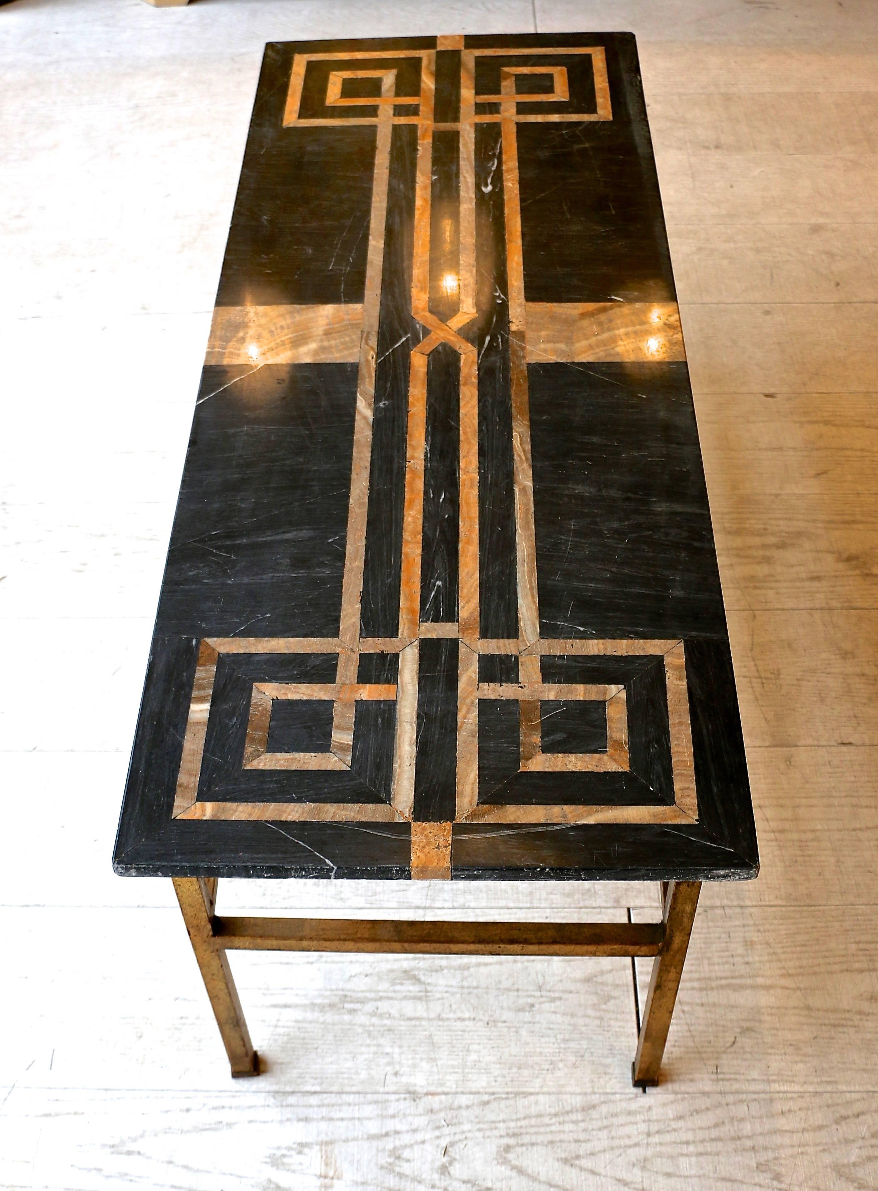 1950s Italian coffee table with marble marquetry top and pretty gilt brass legs.