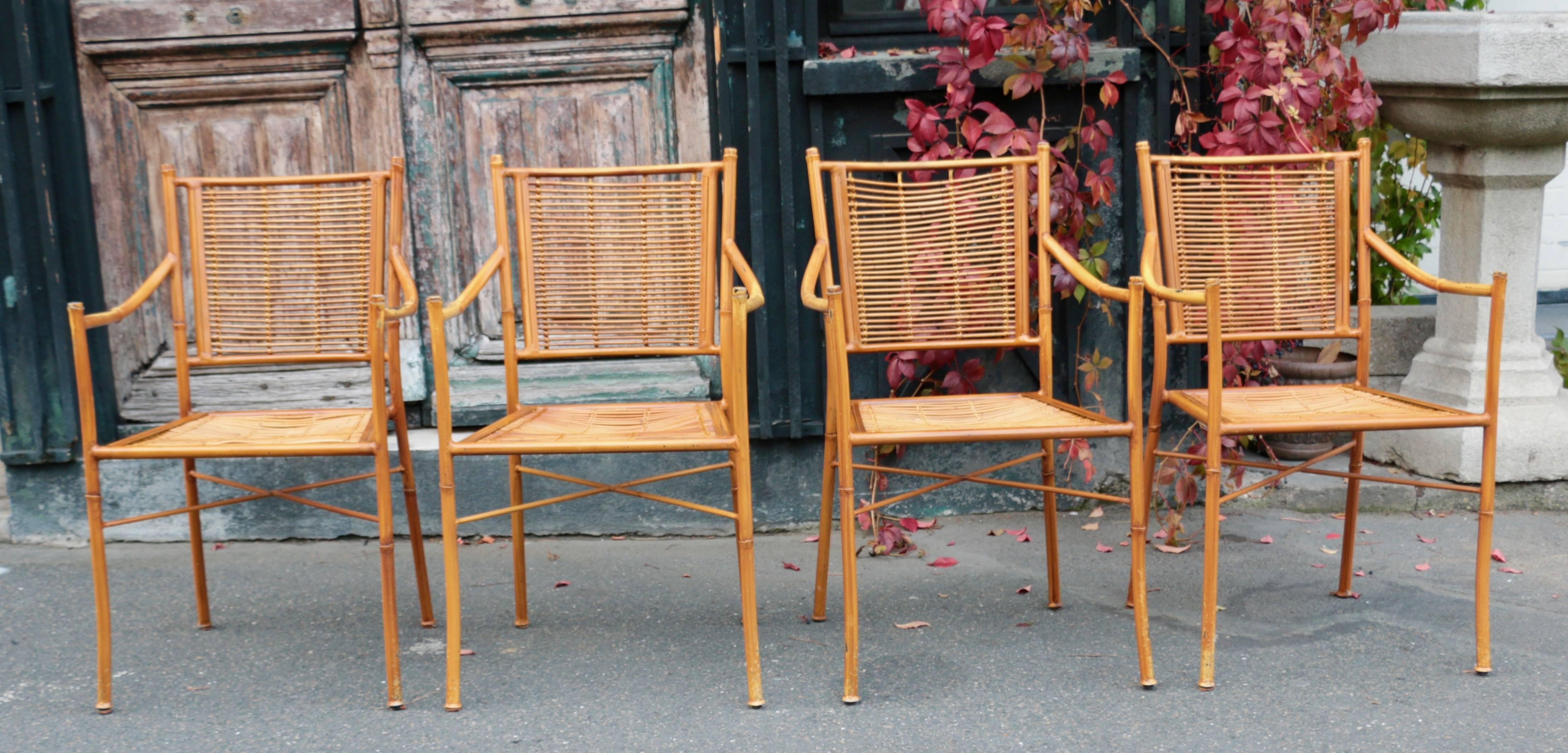 1960s, Italy. A pair of very pretty chairs with wrought iron structure imitating bamboo and bamboo seating.