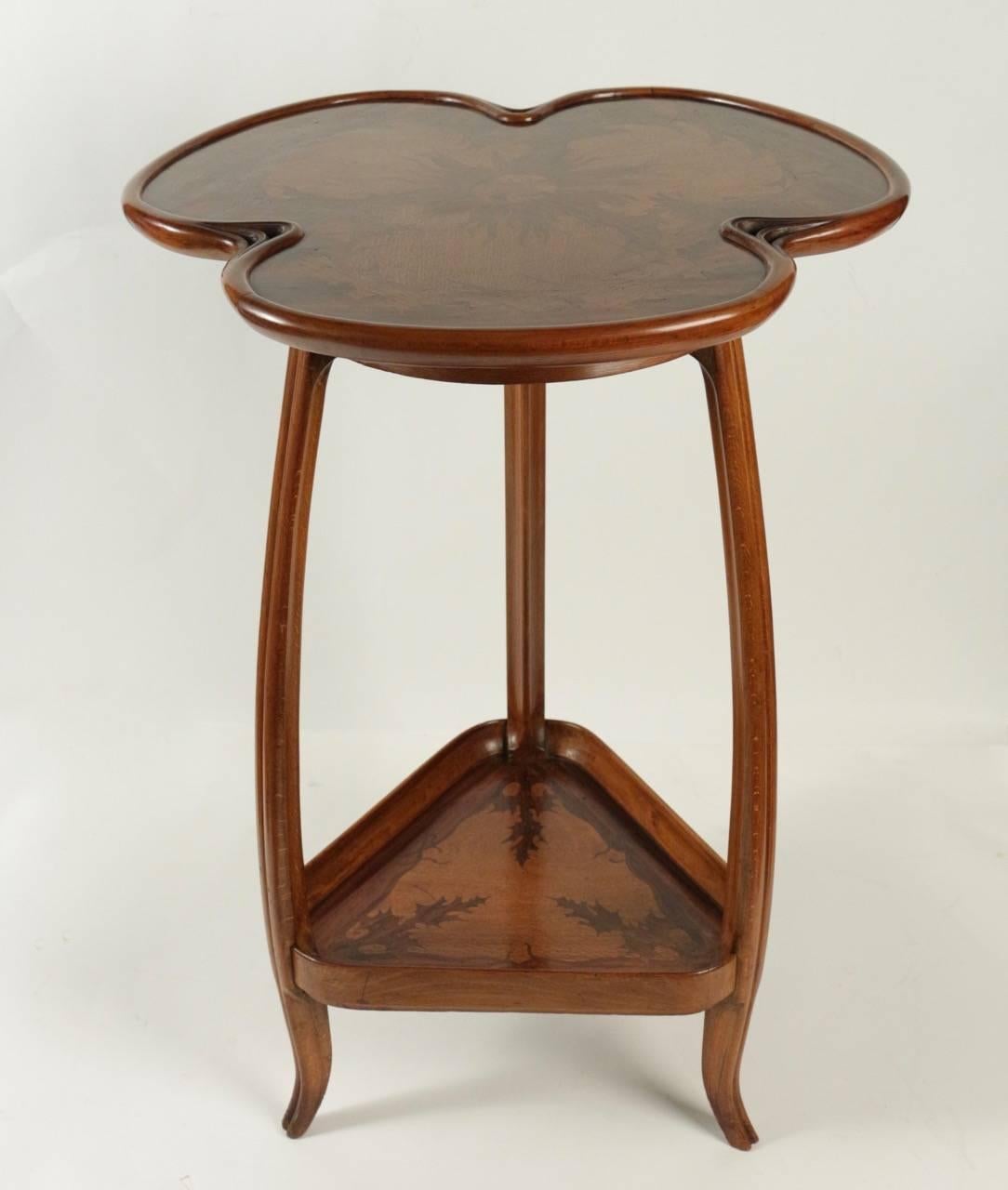 Walnut carved and marquetry gueridon by Louis Majorelle, circa 1900.
Signed : L.Majorelle. 

Measures: H 76cm x
W 52.5cm.

Litterature: Majorelle by Alastair Duncan, p.204.
 